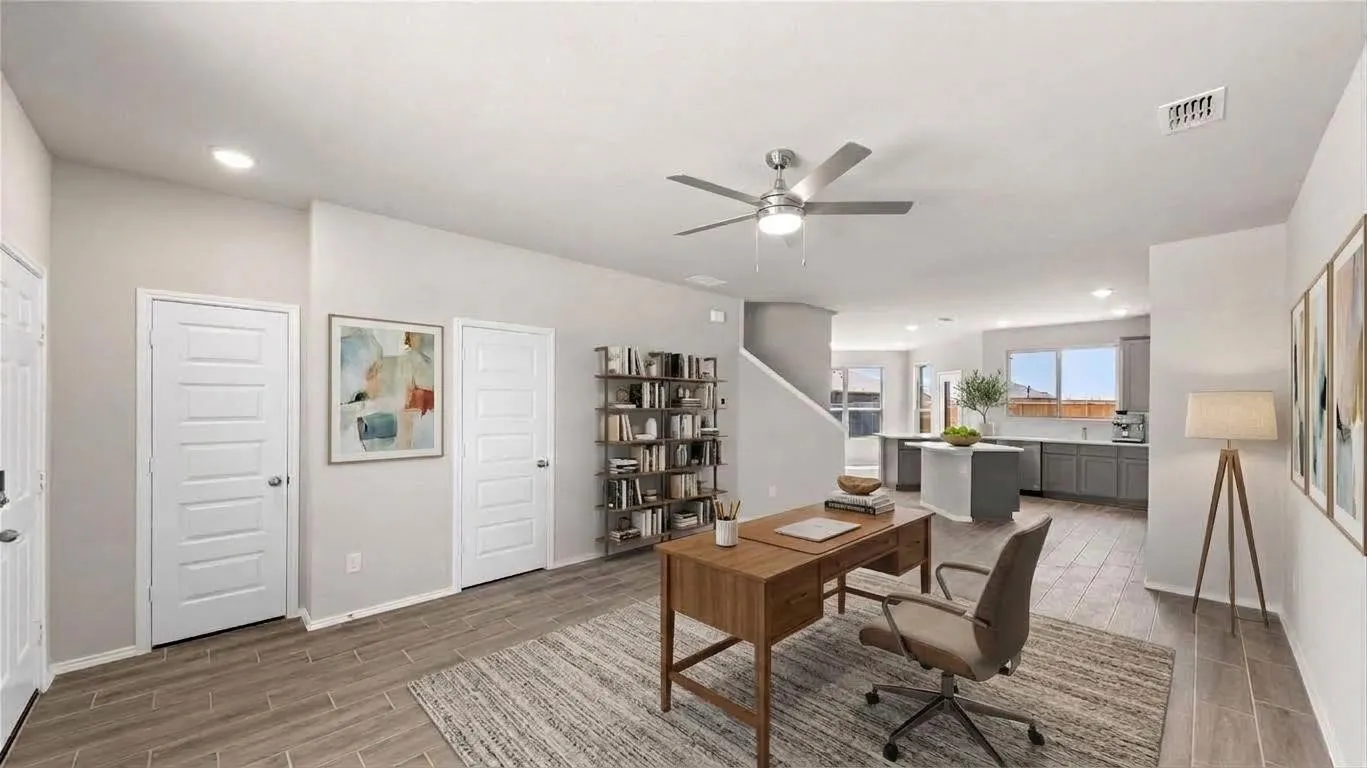 One of two separate living areas downstairs gives the floor plan exceptional flexibility. Virtually staged as a home office, are could be a second living room or lounge area as well.