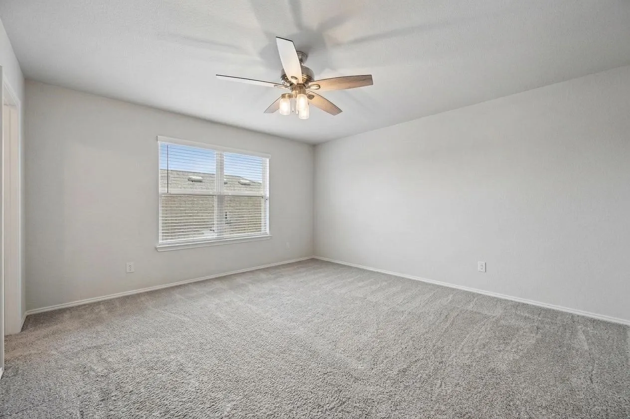 Secondary bedroom located upstairs near the game room and full bath.