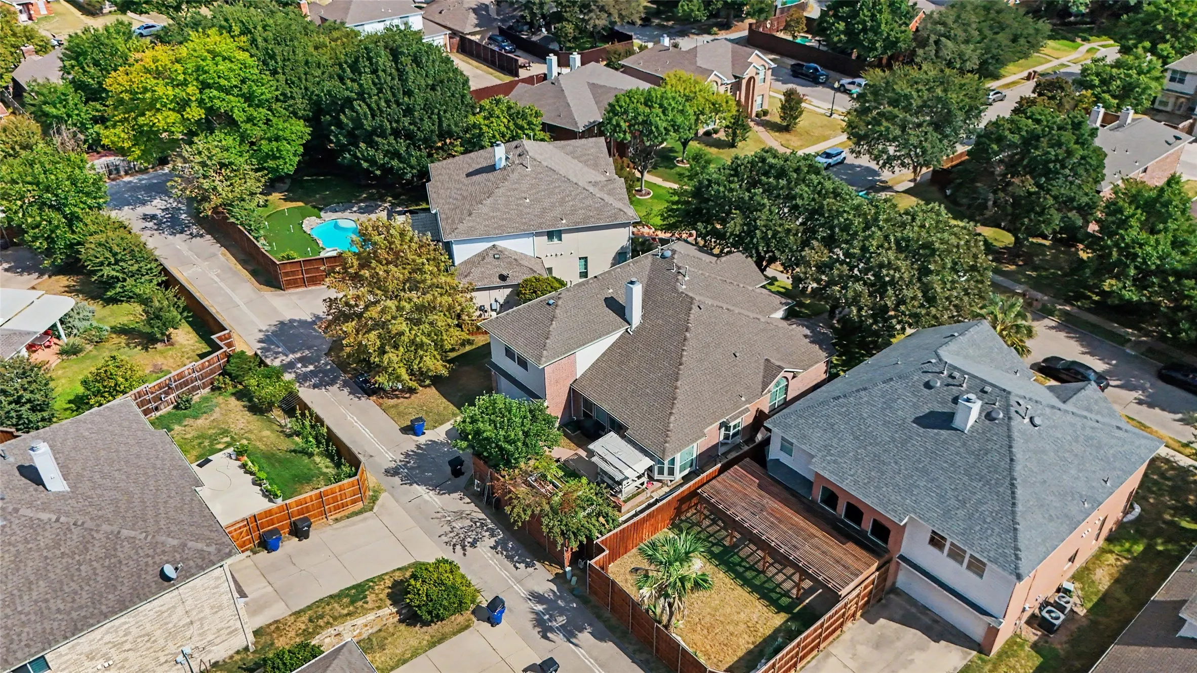 Residential property featuring a shingle roof and a private fenced yard with a​​‌​​​​‌​​‌‌​‌‌​​​‌‌​‌​‌​‌​​​‌​​ pool