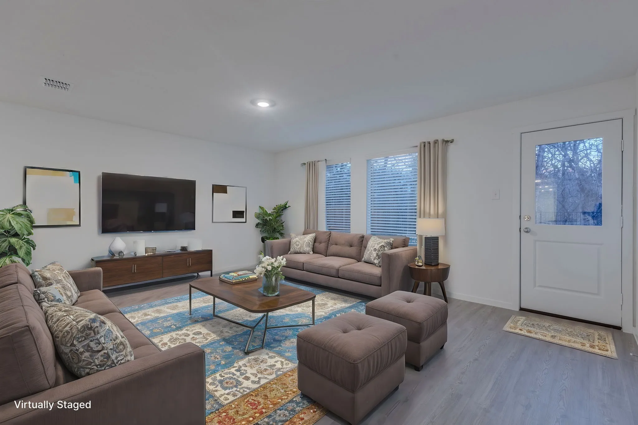 Living room with wood-type flooring