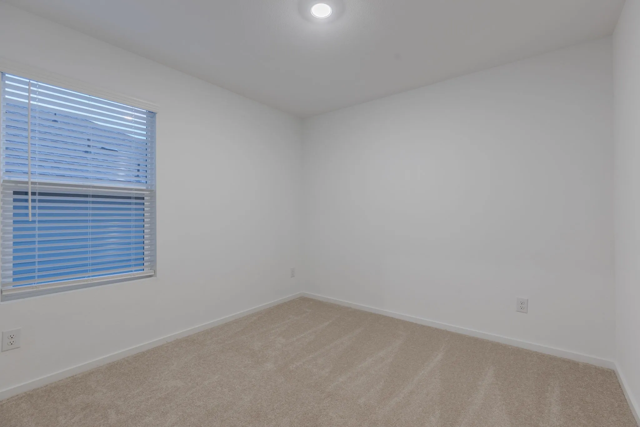 Empty room featuring carpet flooring