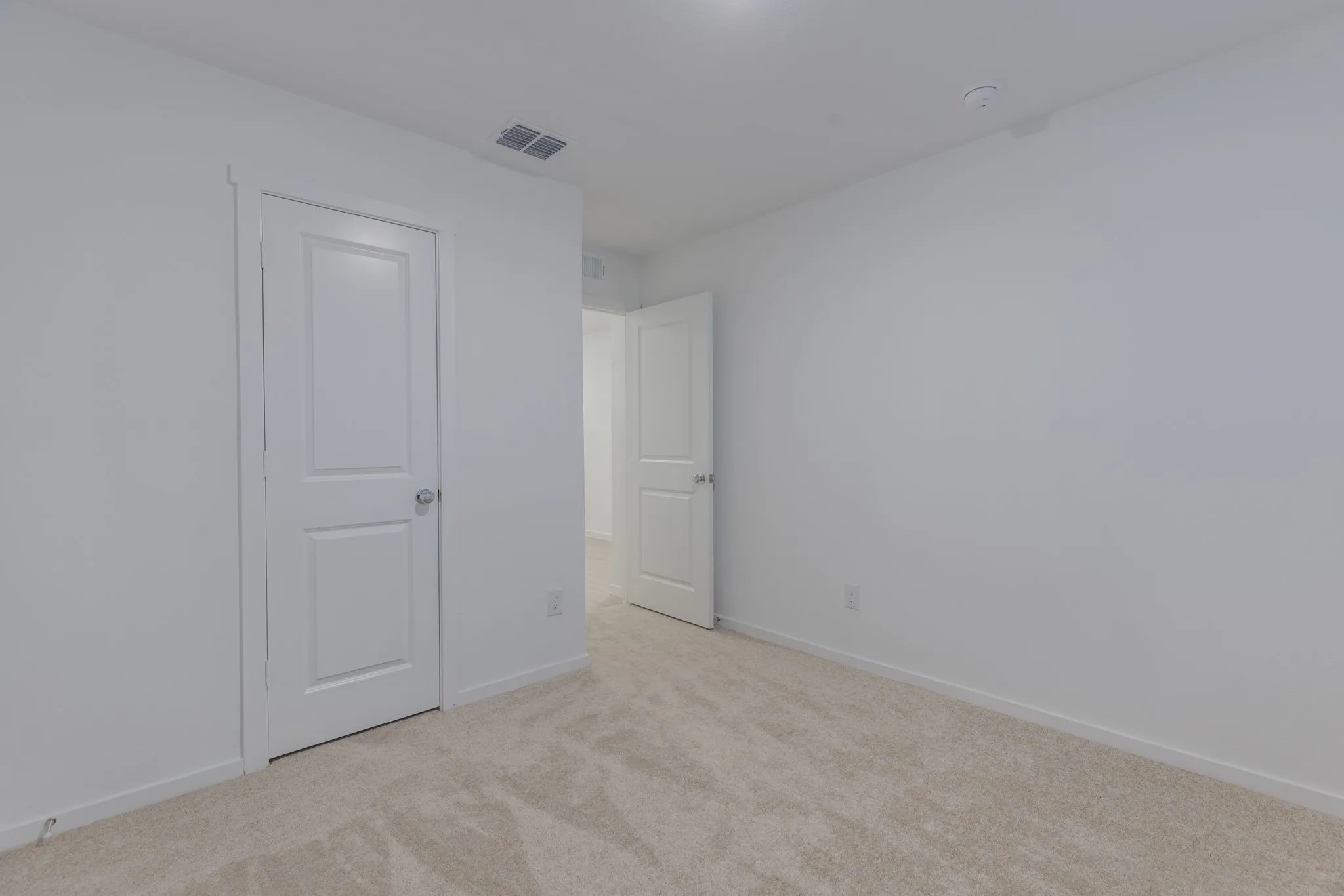Empty room with light carpet