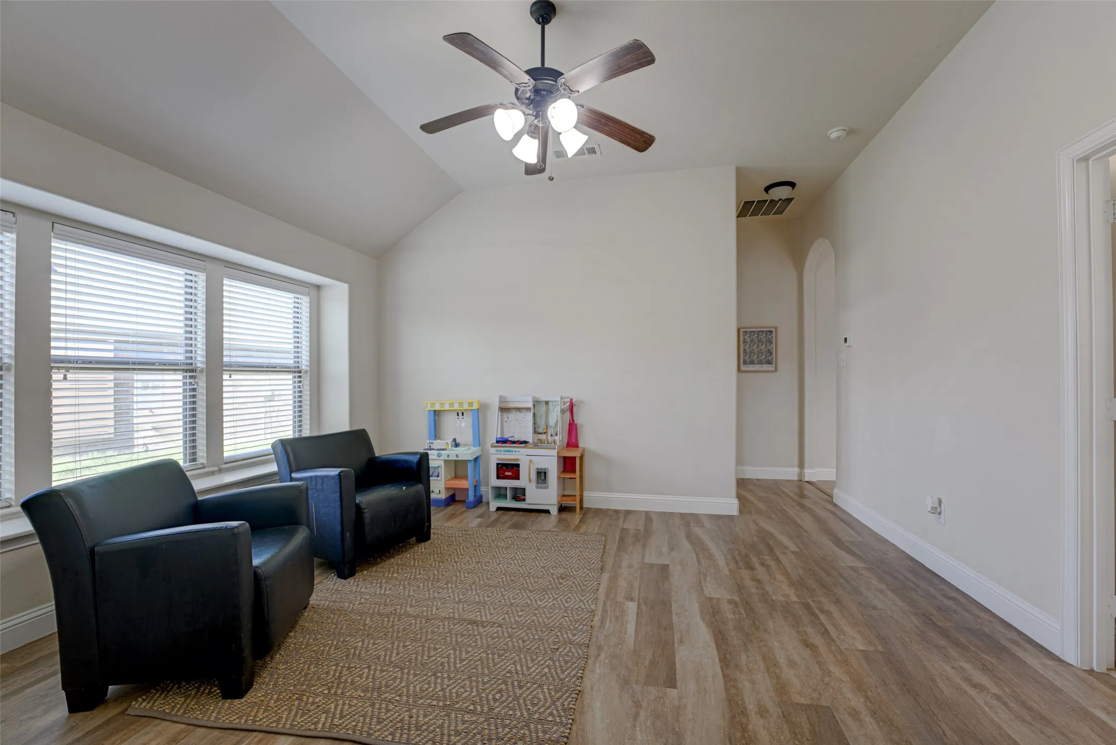 Game room with closet and window seat.