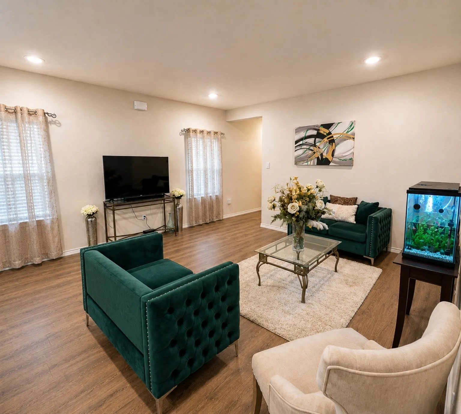 Recessed lighting illumination, wood-finish flooring, and multiple window openings
