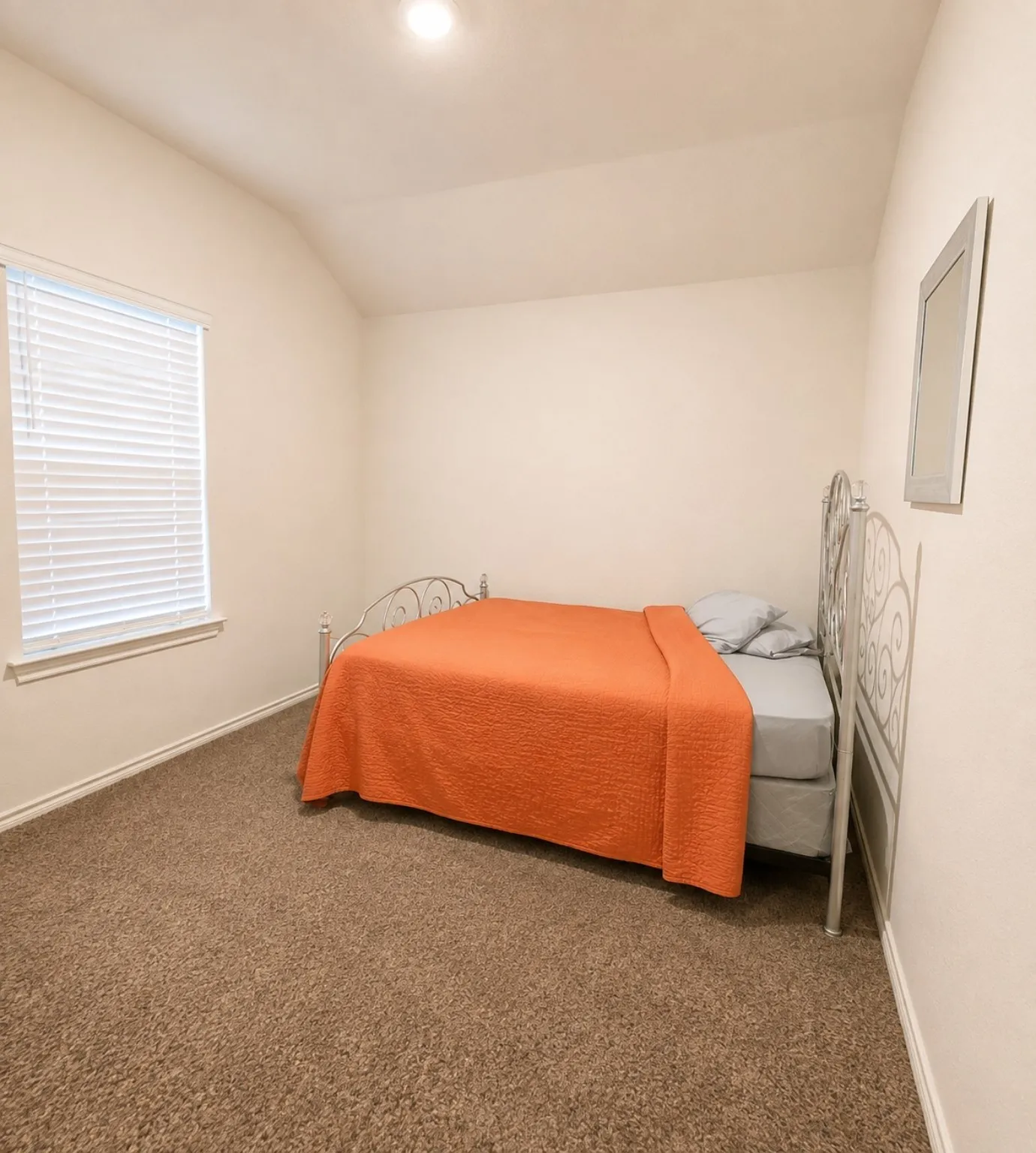 Vaulted ceiling, recessed ceiling lighting, window with blinds, carpeted flooring