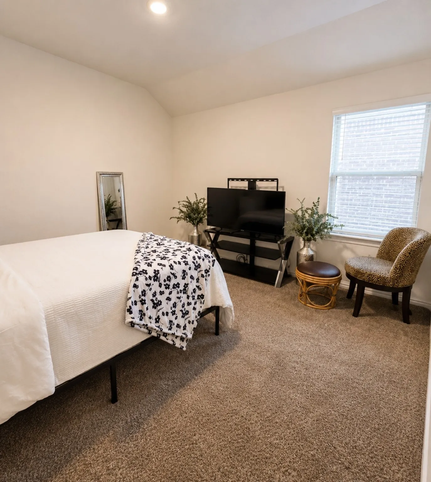 Recessed ceiling lighting, light neutral wall paint, window with blinds, and neutral carpet flooring