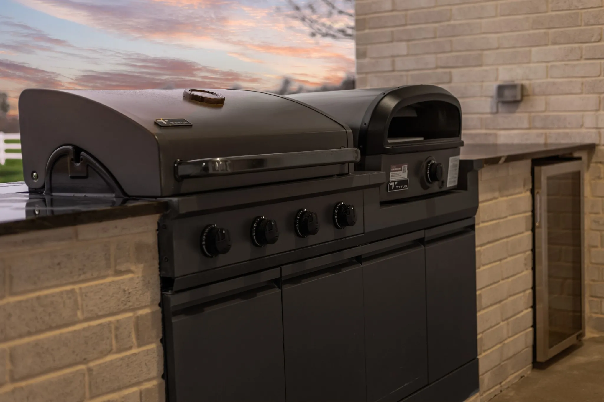 Back Patio with Grill and Refrigerator for easy access!
