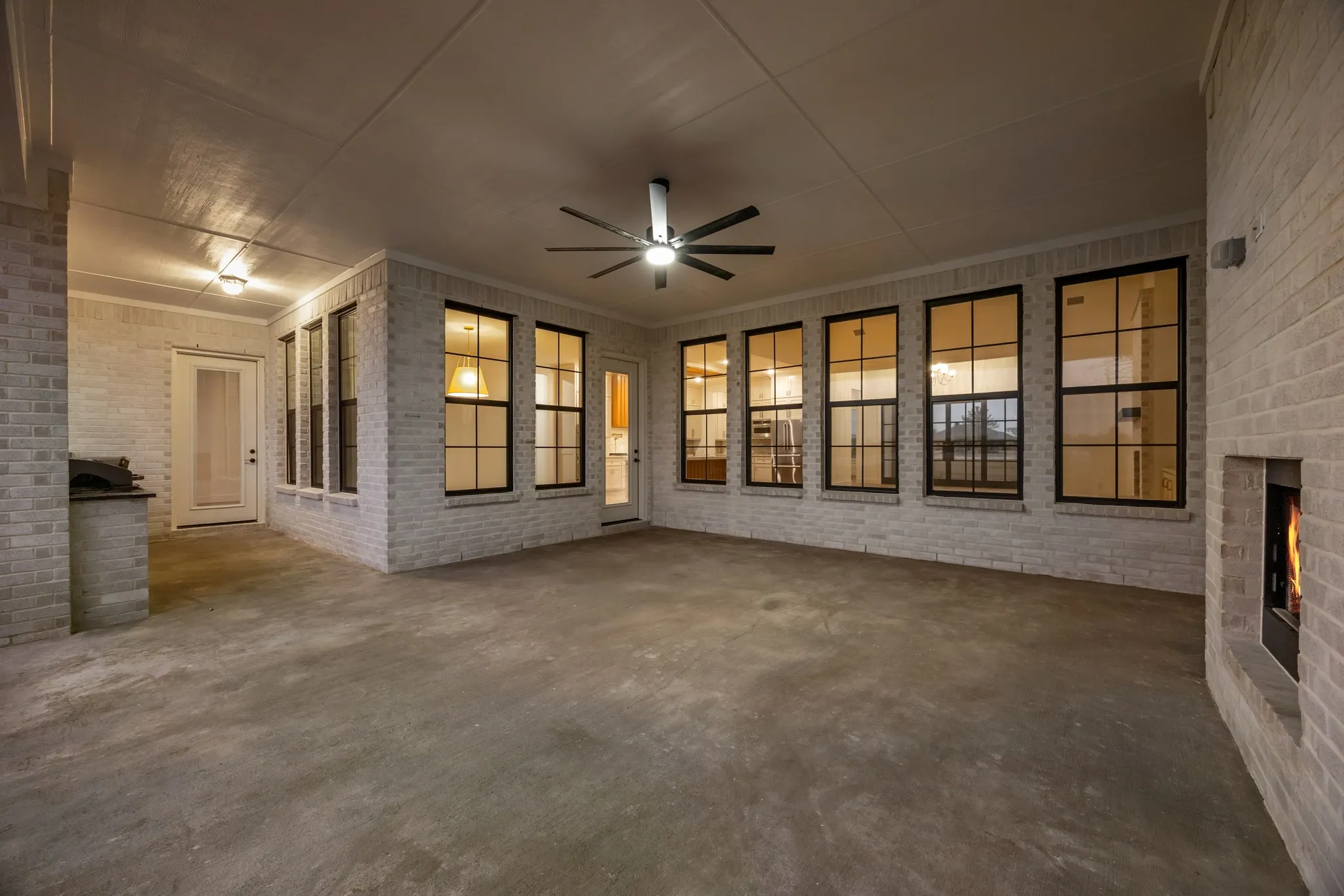 Covered Patio with Fireplace and Grill & small Frig to entertain Family & Friends!