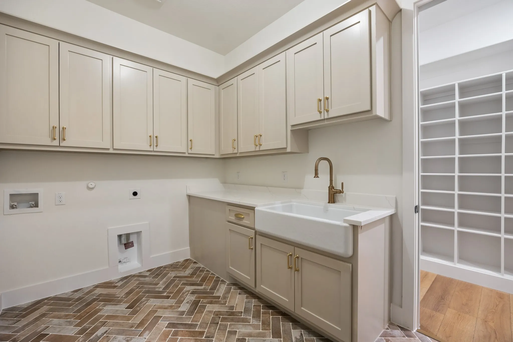 Large Laundry Room with Utility Sink and Cabinets!  Featuring Herringbone Tiled Flooring!