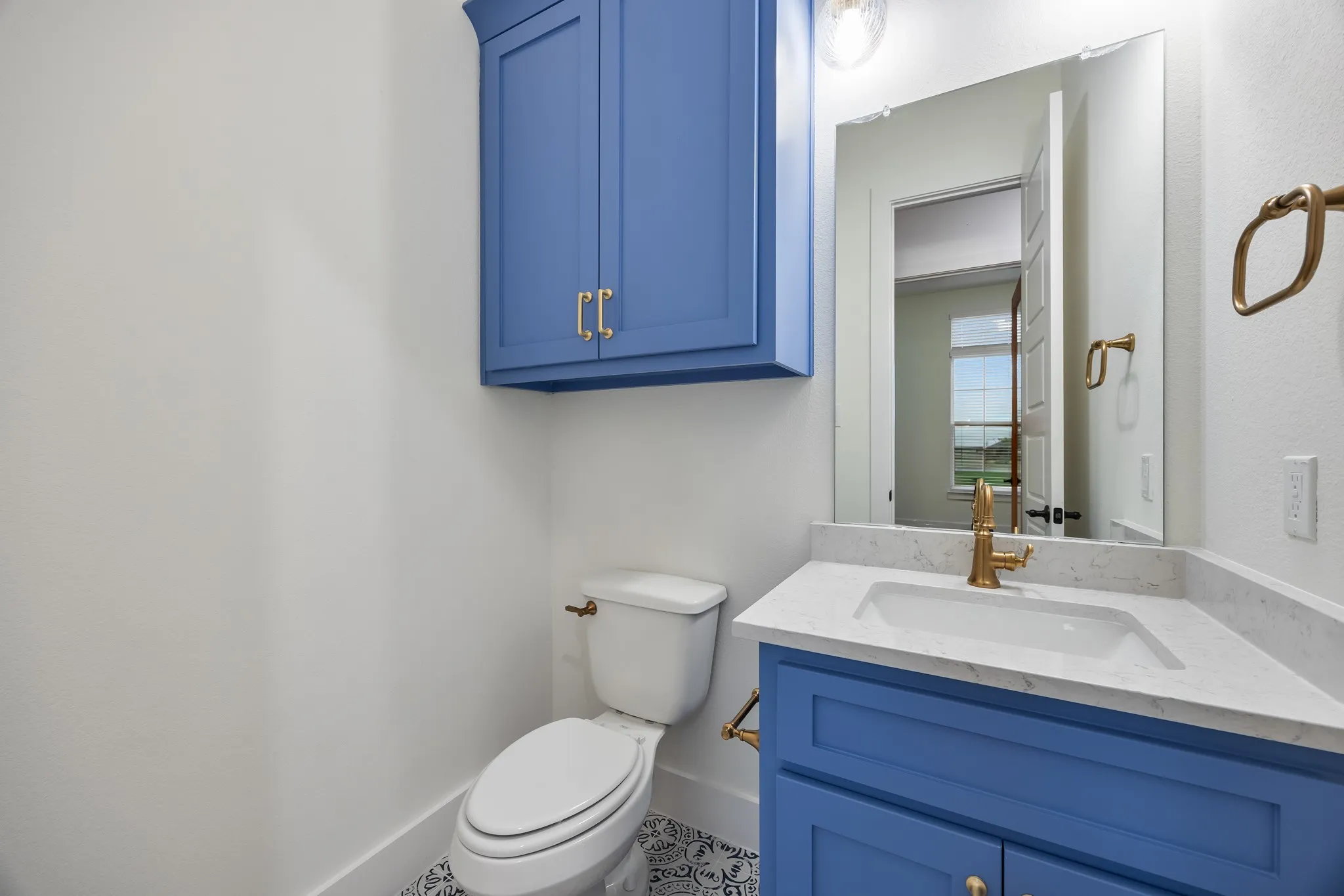 Bathroom with Shower/bath combination with glass doors & quartz vanity!