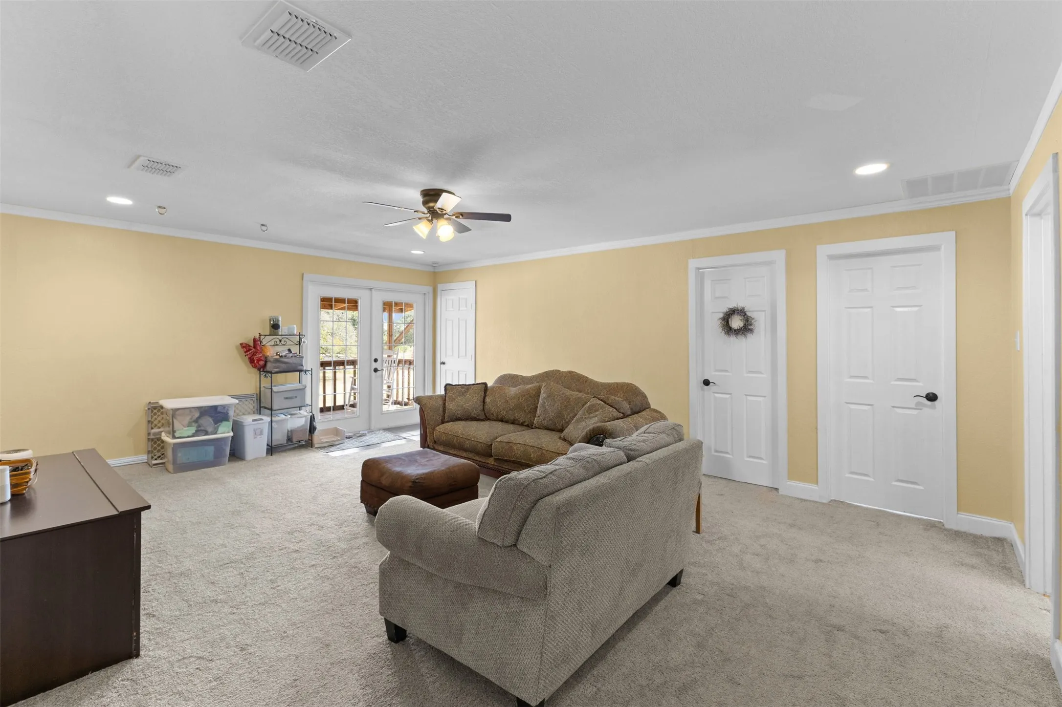 Upstairs bonus/family room with French doors to a private balcony, room for a second living area, media room, or game room.