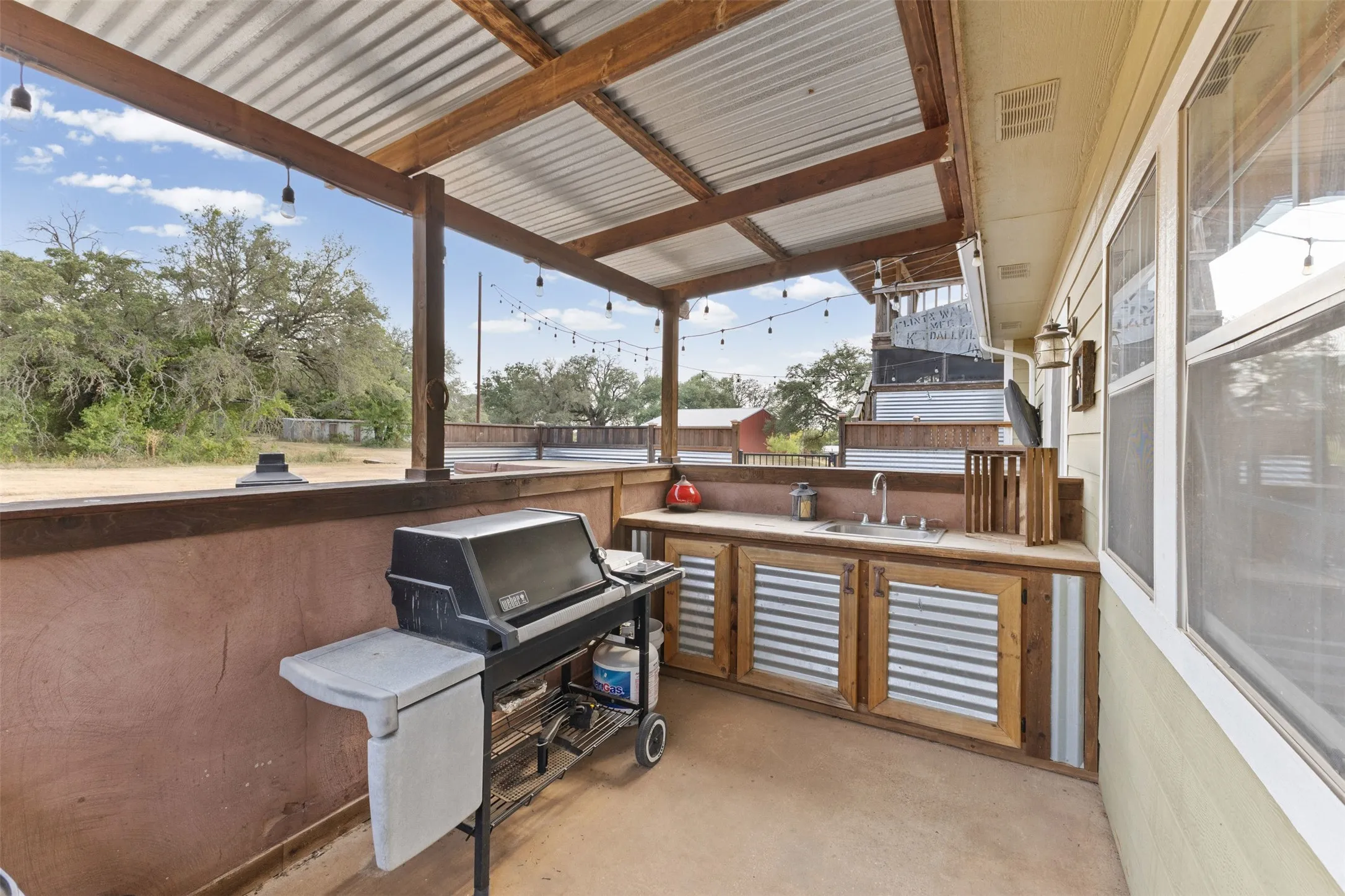 Outdoor kitchen with sink.  Grill is negotiable.