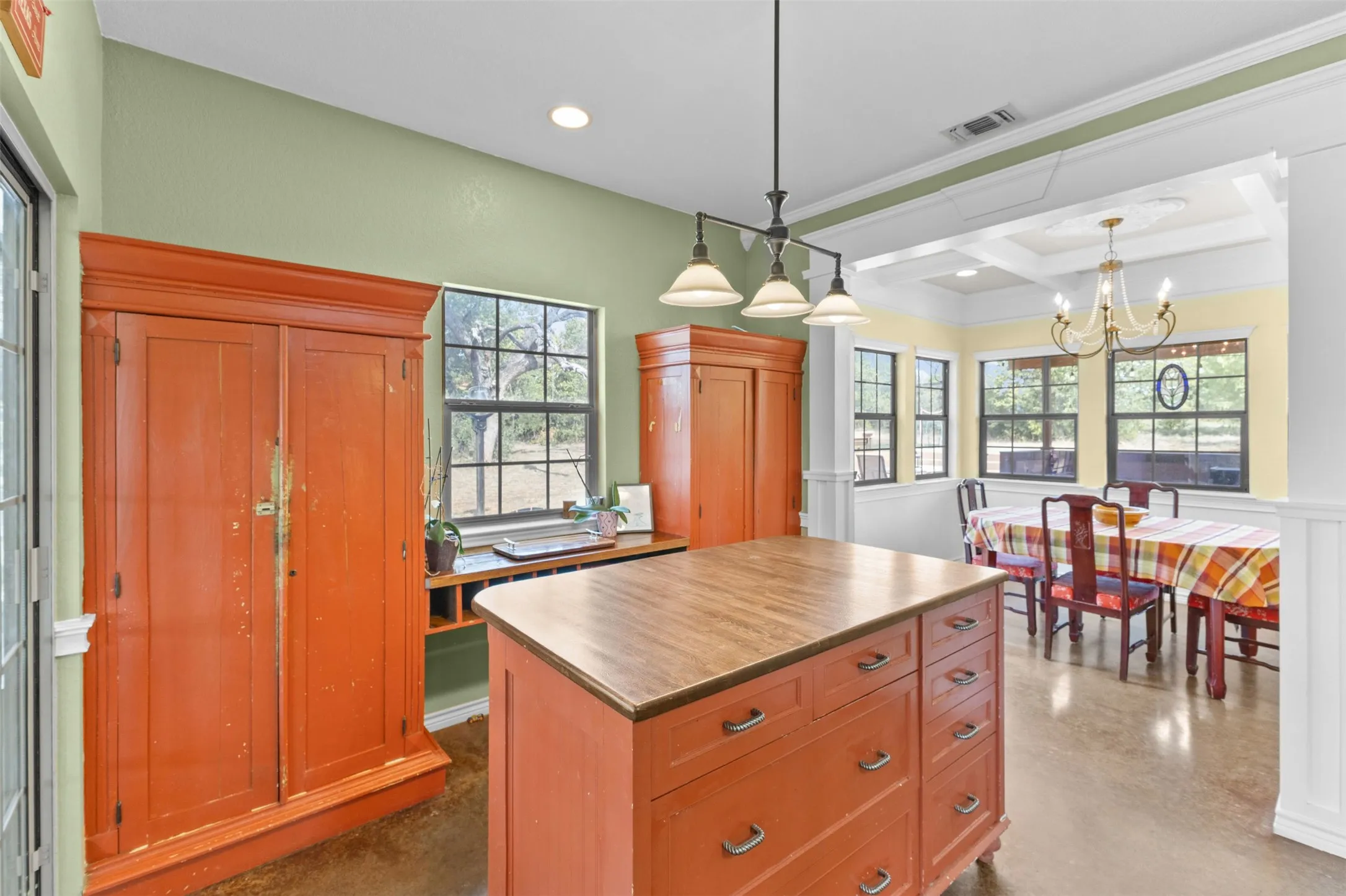 Kitchen island with wood-finish countertop and drawers