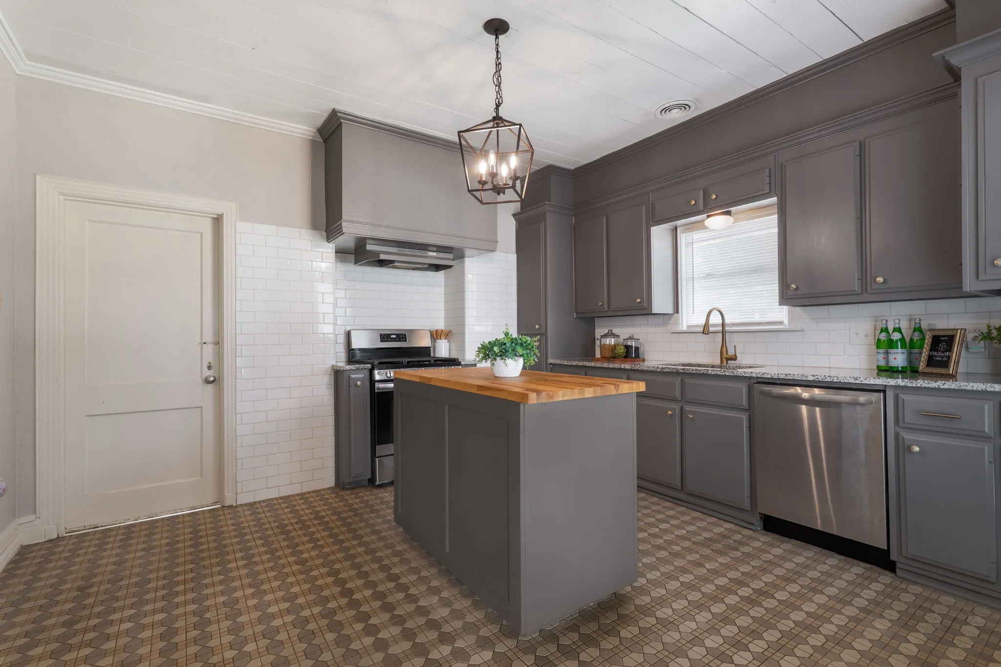 tile floor, center island, updated kitchen and granite countertops