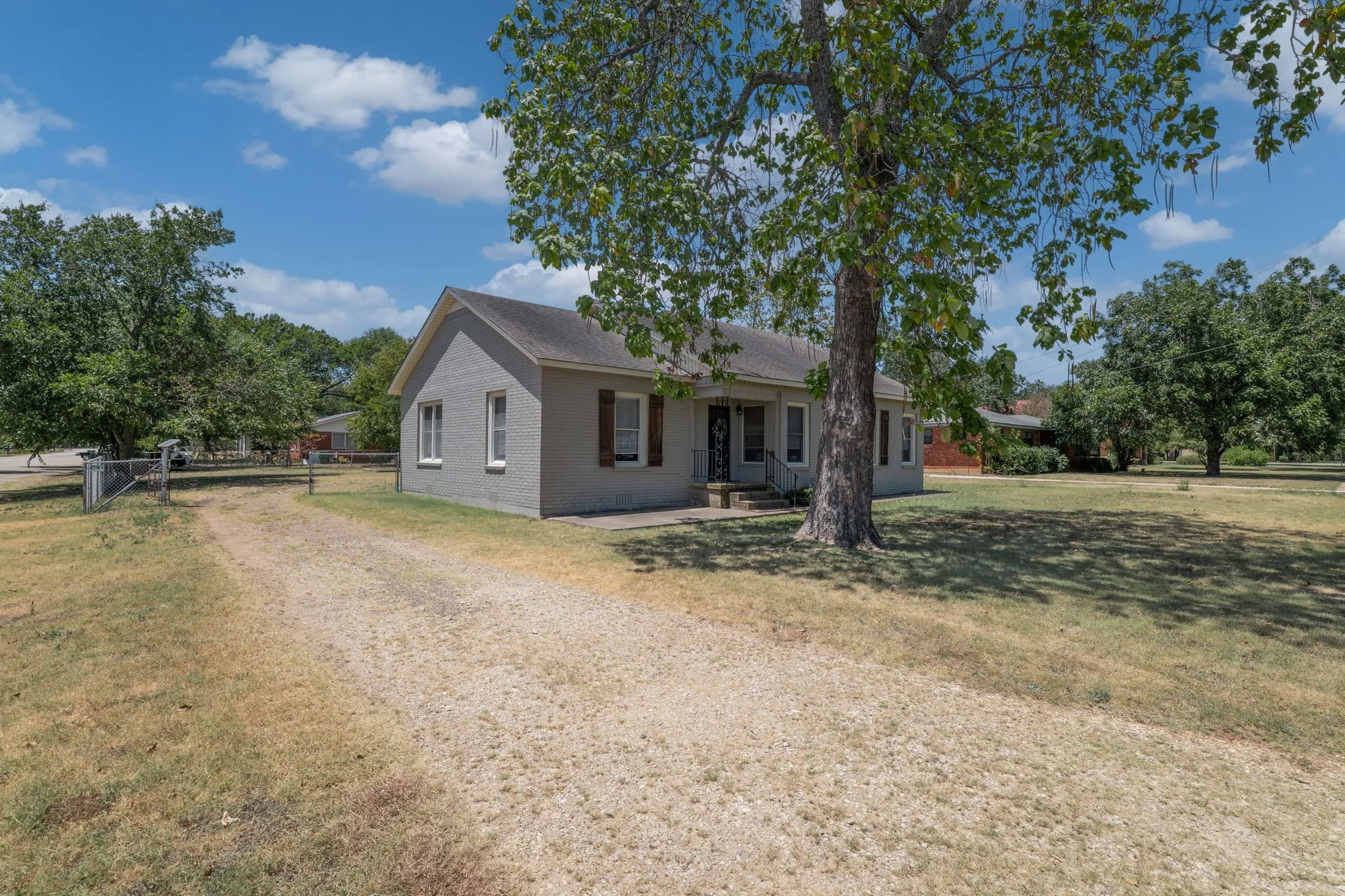 driveway and gate to rear garage; corner lot