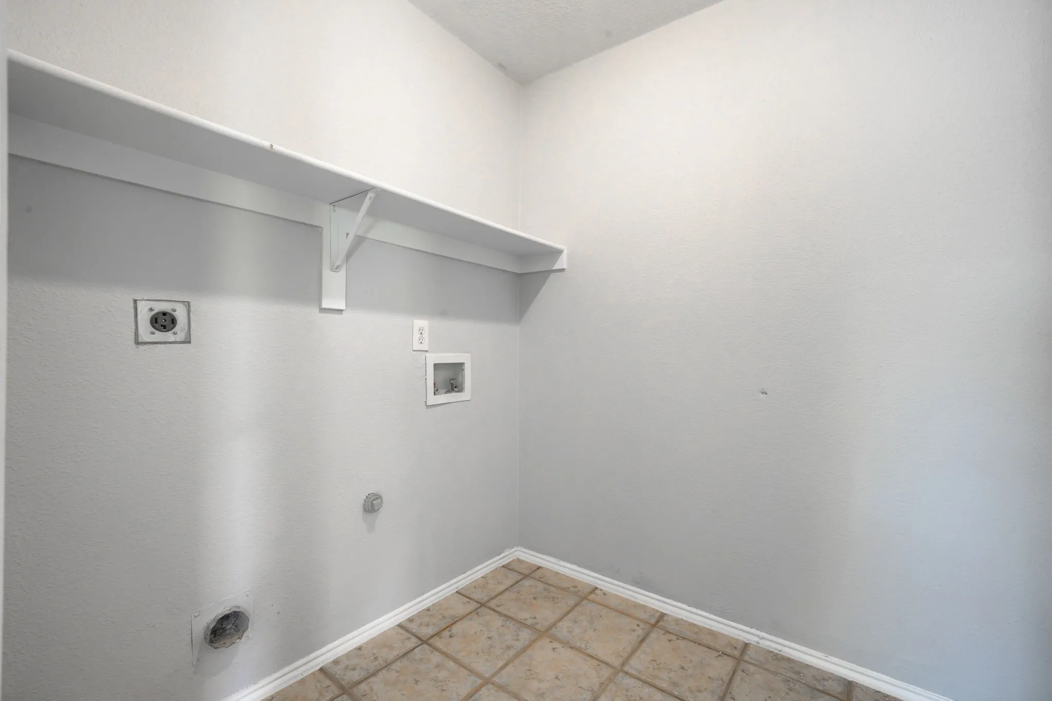 Utility connections, integrated shelving, and tile flooring