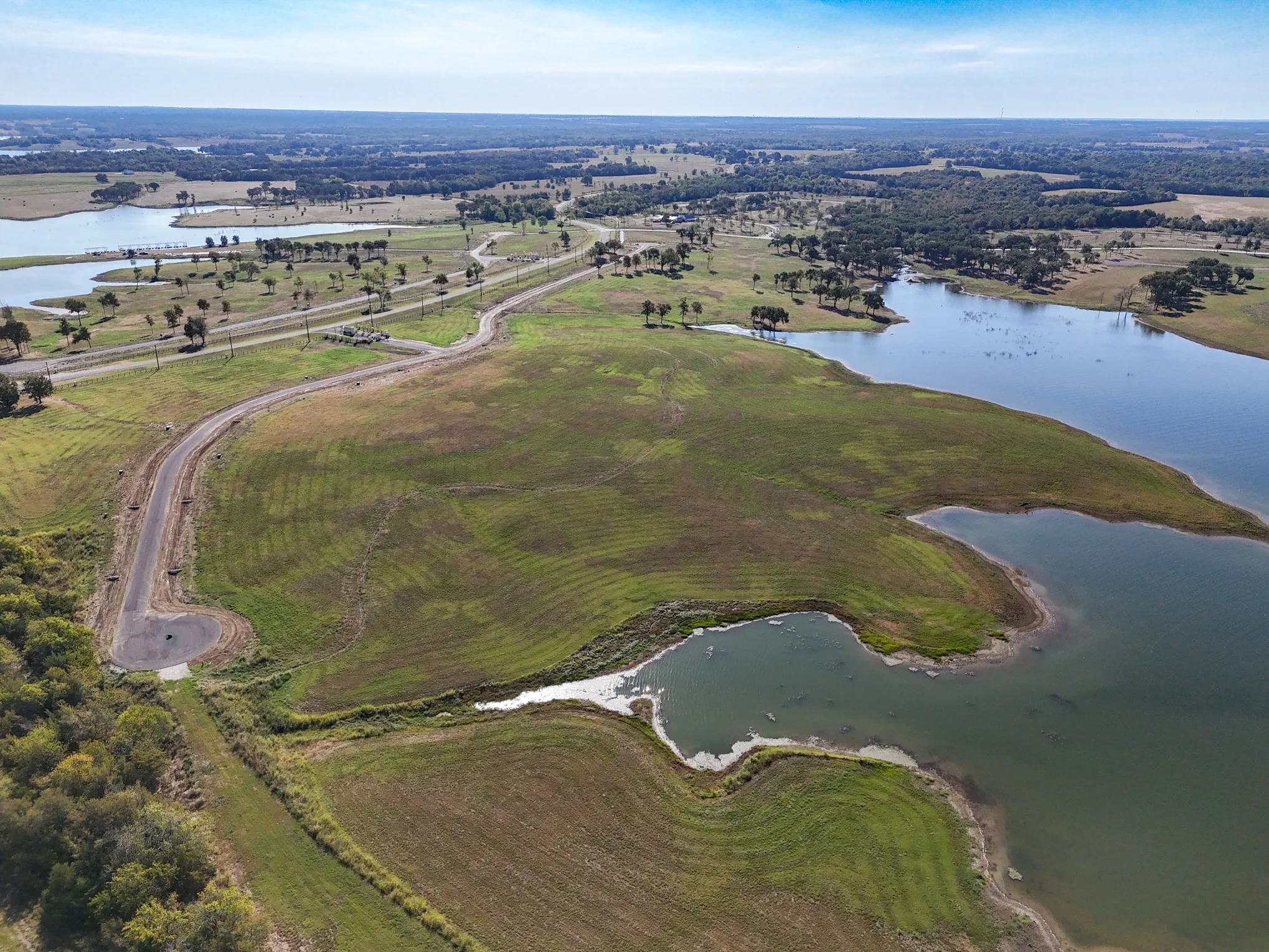 Aerial view of property's location with a nearby body of water