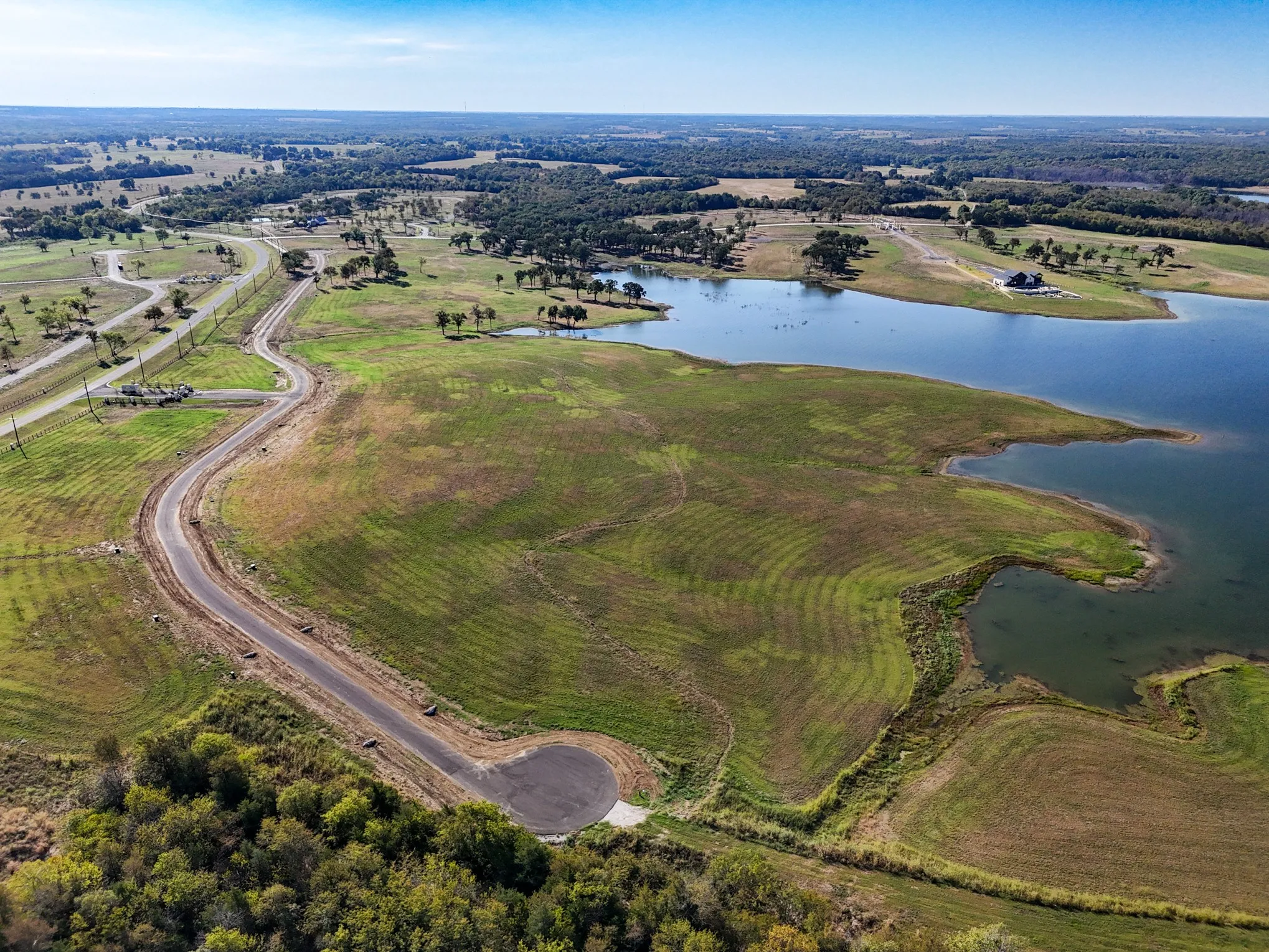 Aerial overview of property's location featuring a nearby body of water