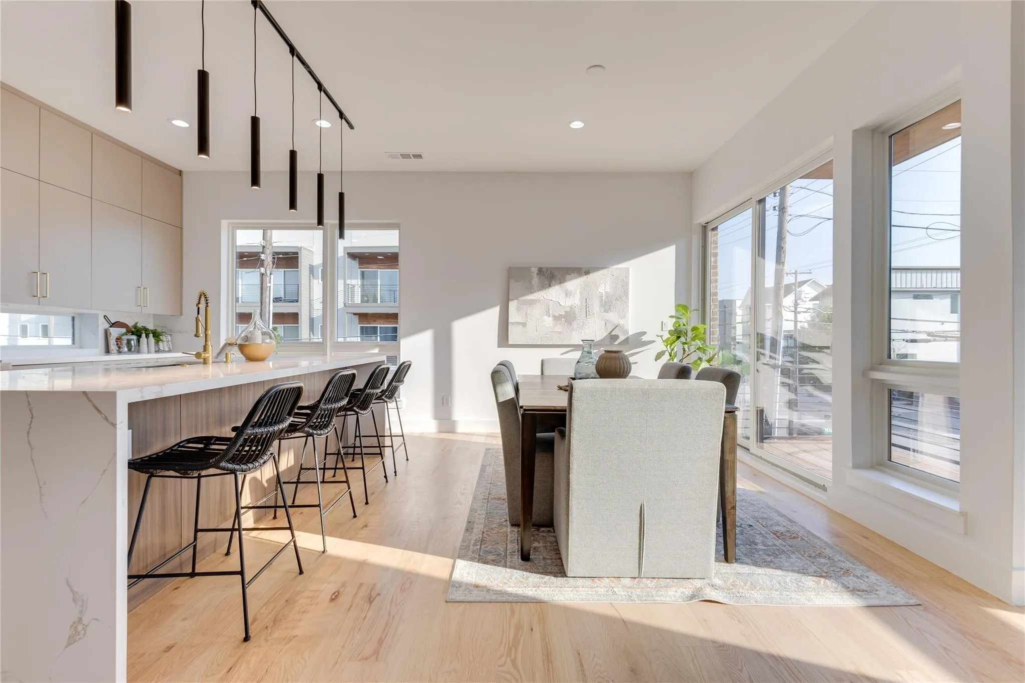 Dining space featuring sink and light hardwood / wood-style flooring