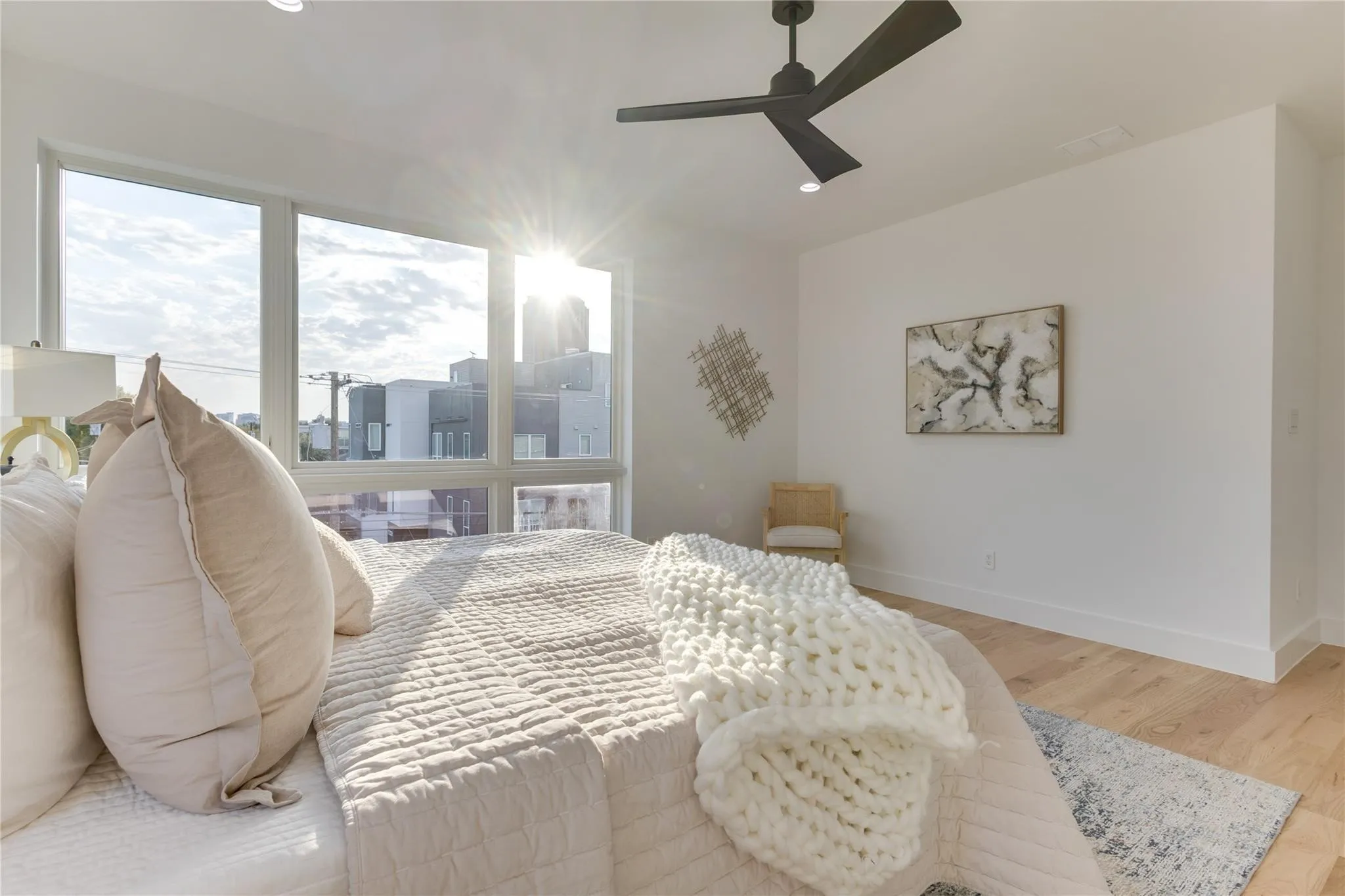Bedroom featuring ceiling fan and light hardwood / wood-style flooring