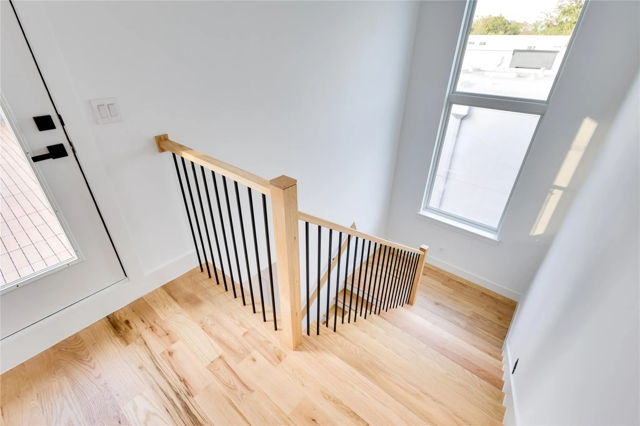 Stairs featuring wood-type flooring