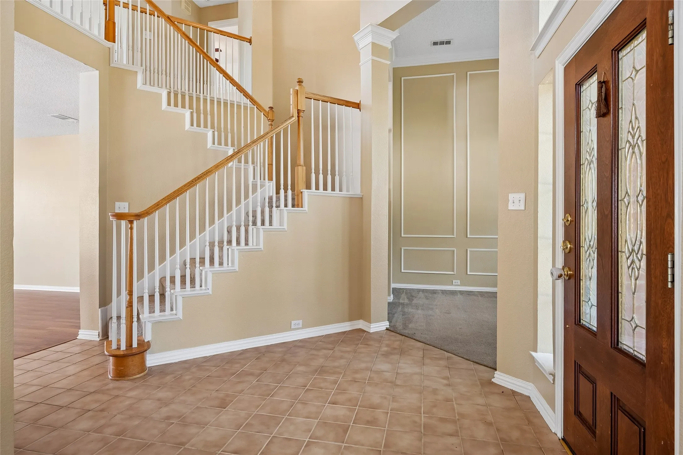 Large Foyer and pretty staircase split the formal rooms