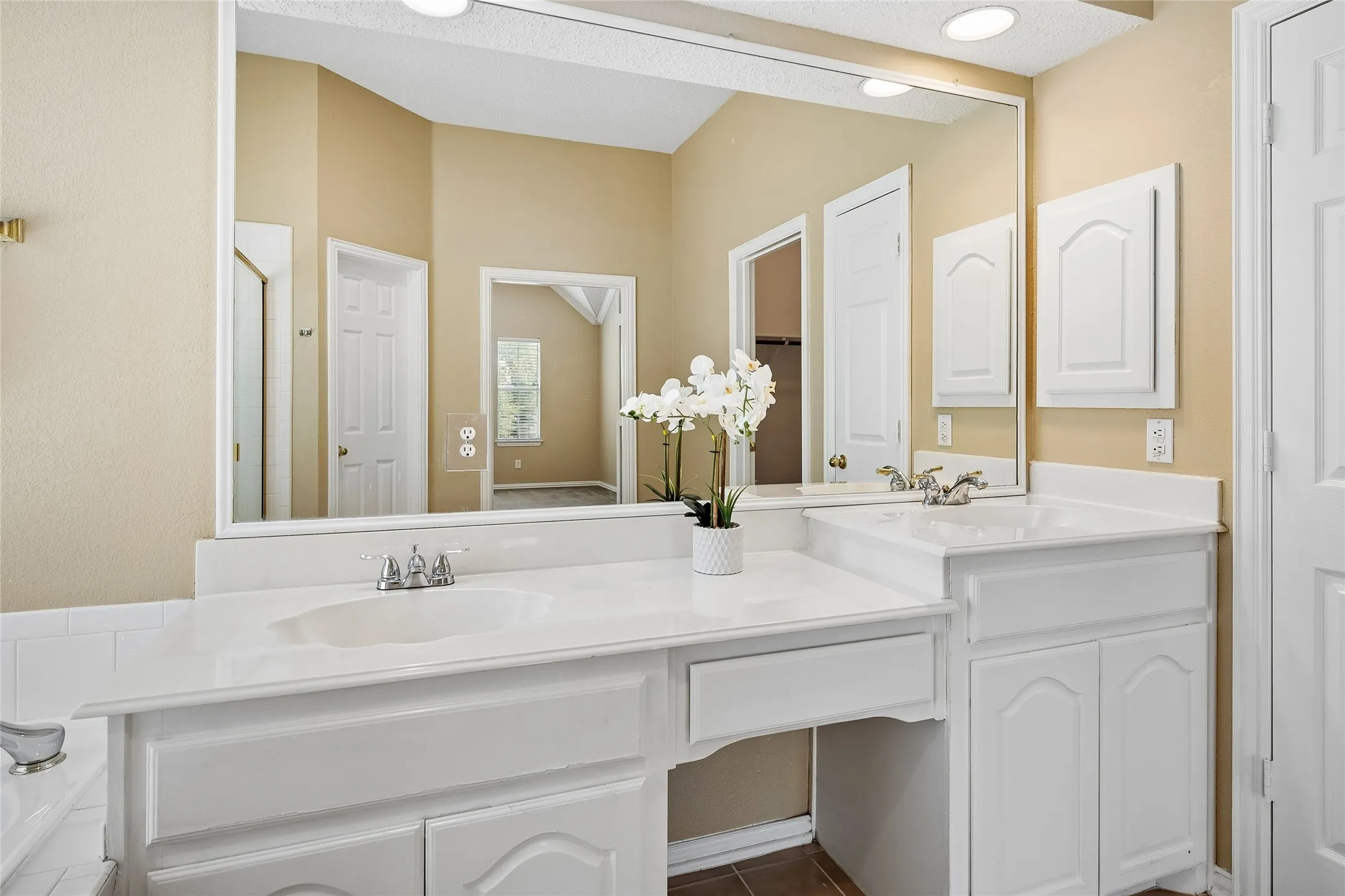 Make-up vanity between sinks and a medicine cabinet!