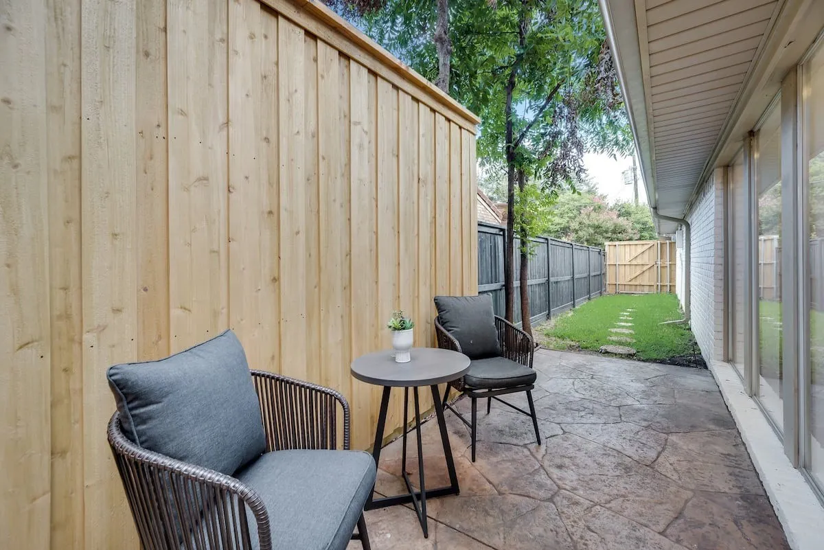 Side patio off the kitchen with grill & yard for the pups!