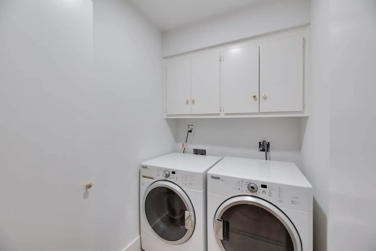 Laundry room with washer and dryer and space to build a folding table.