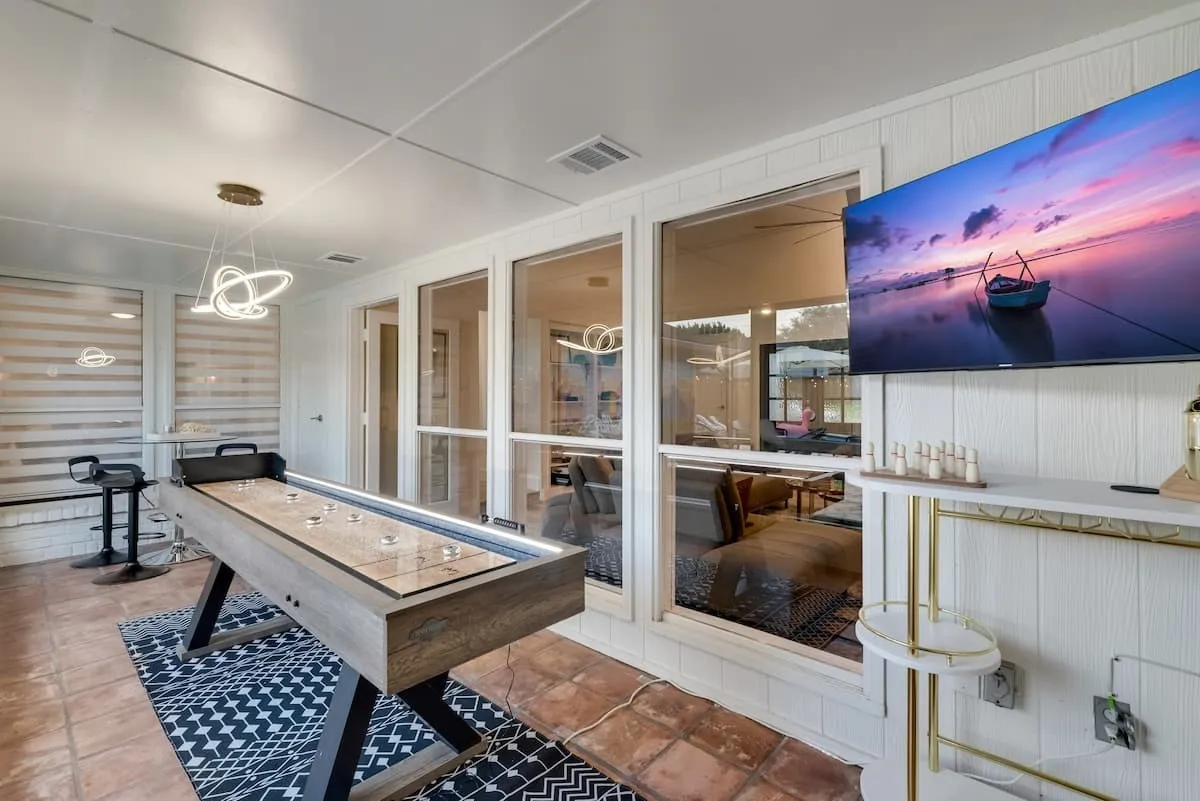 Shuffleboard and seating for 4 in front of the Smart TV!