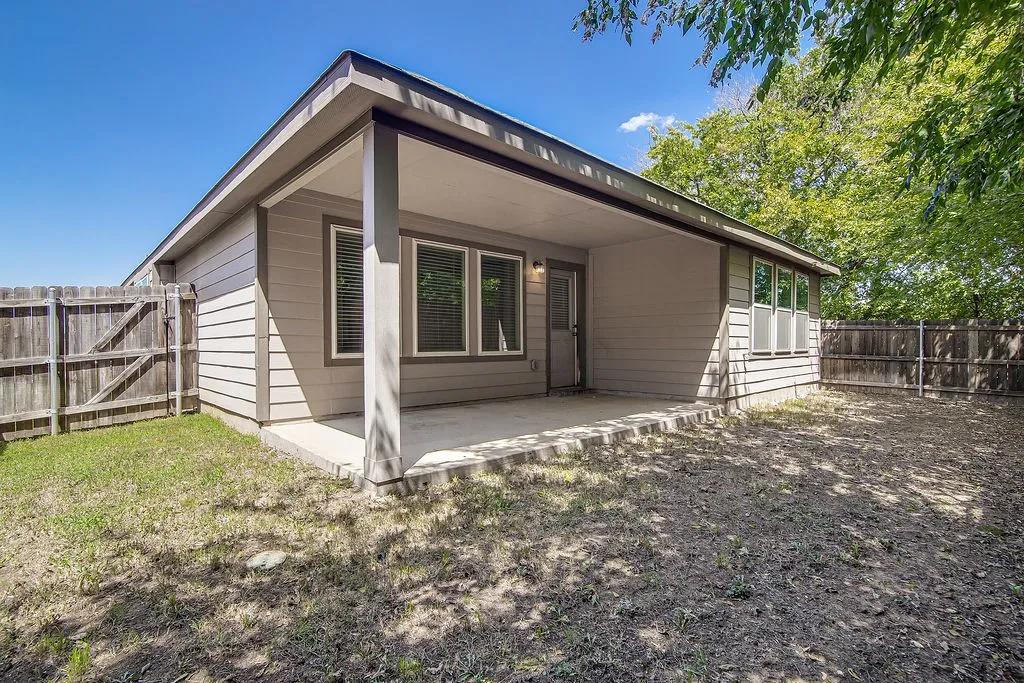 Covered concrete patio with siding exterior