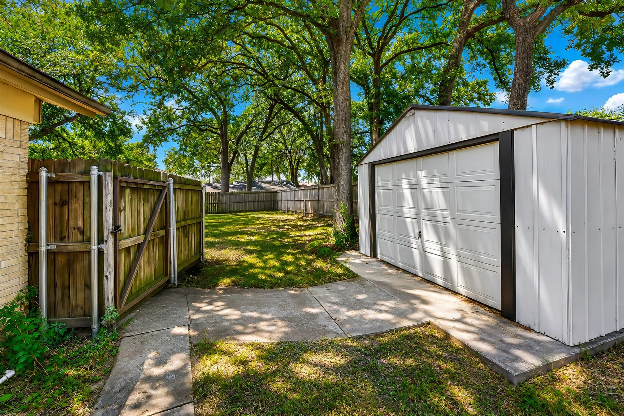 From the back patio looking south with the storage shed to the right.