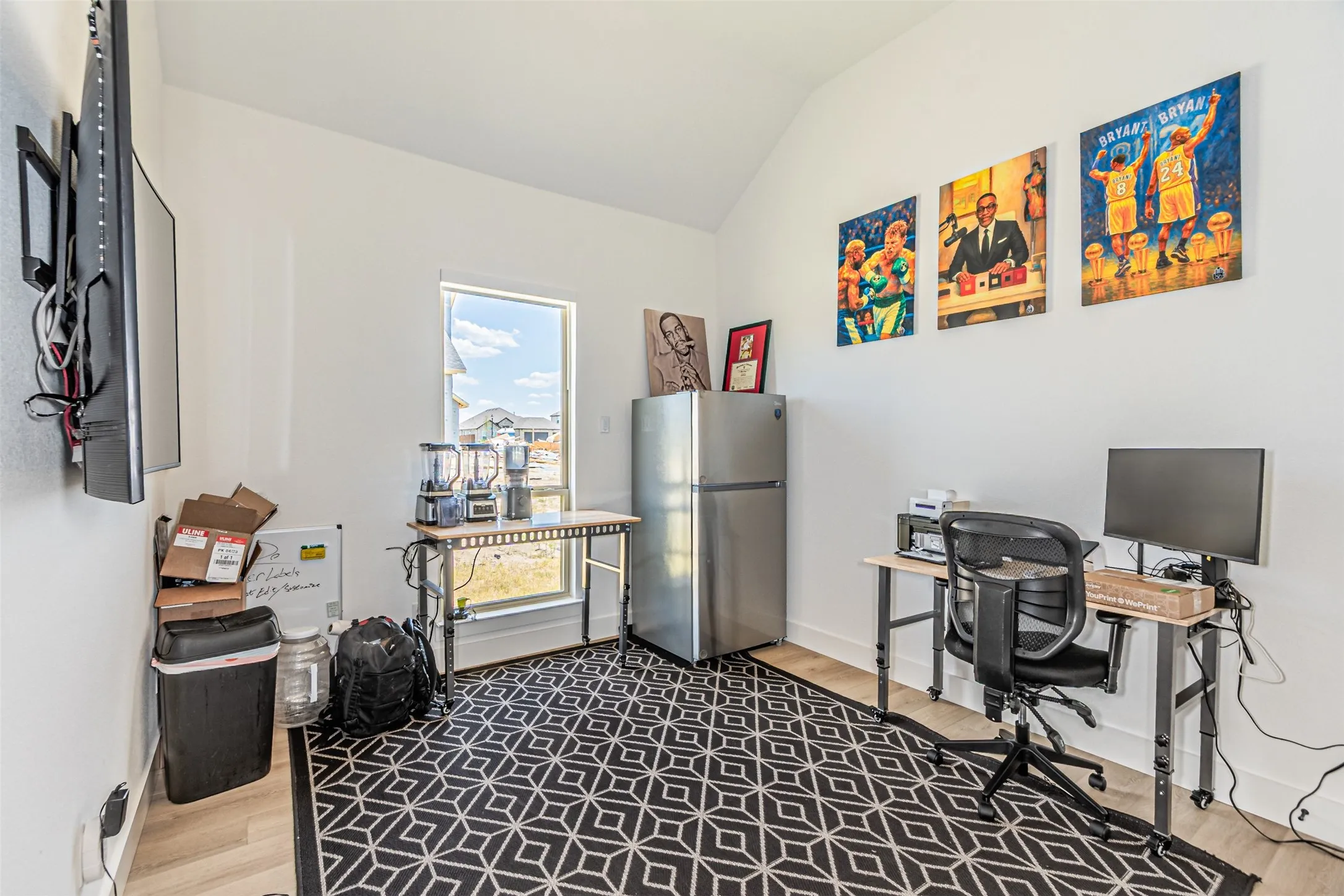 Vaulted ceiling, recessed window, light wood-finish flooring, white walls
