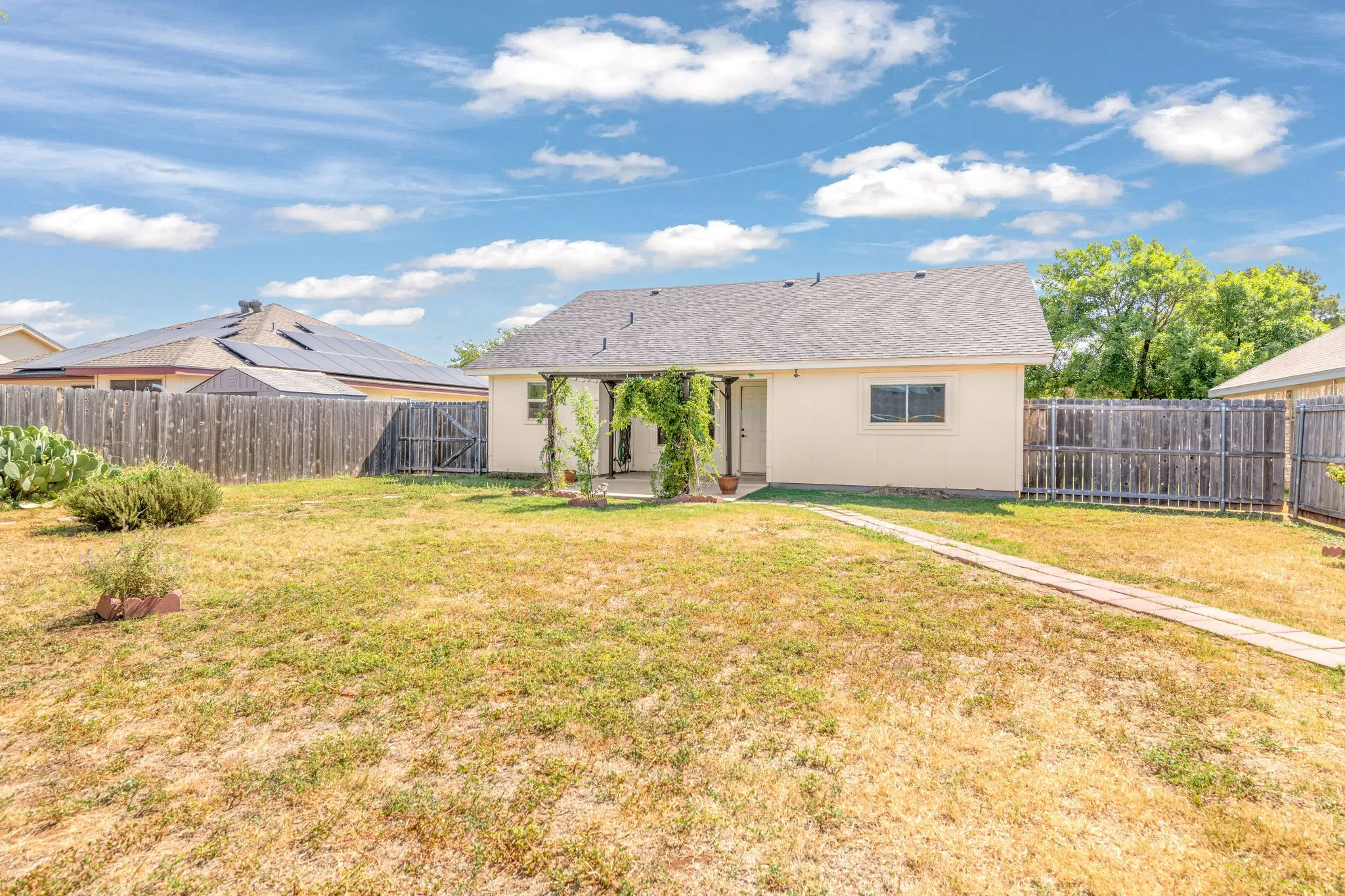 Backyard featuring a privacy fence.