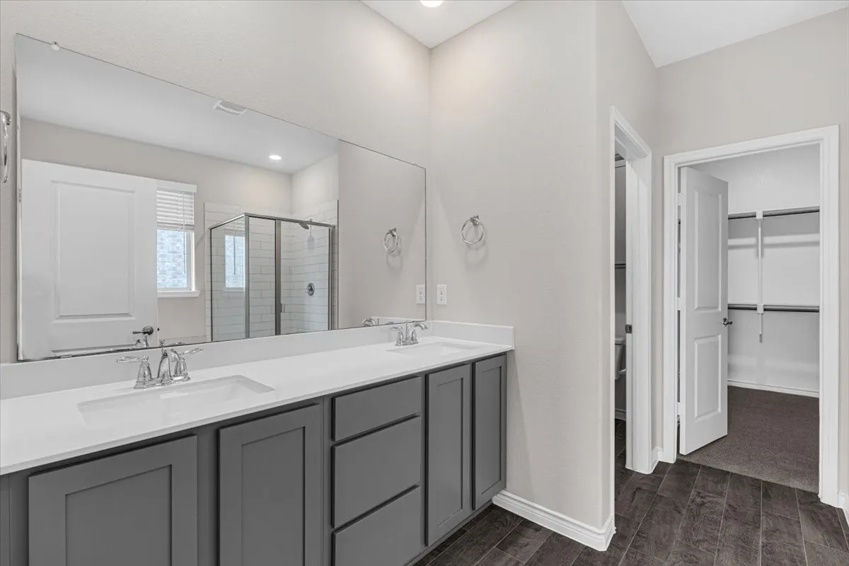 Wonderful master bath with dual sinks, separate shower, and rejuvenating soaking tub