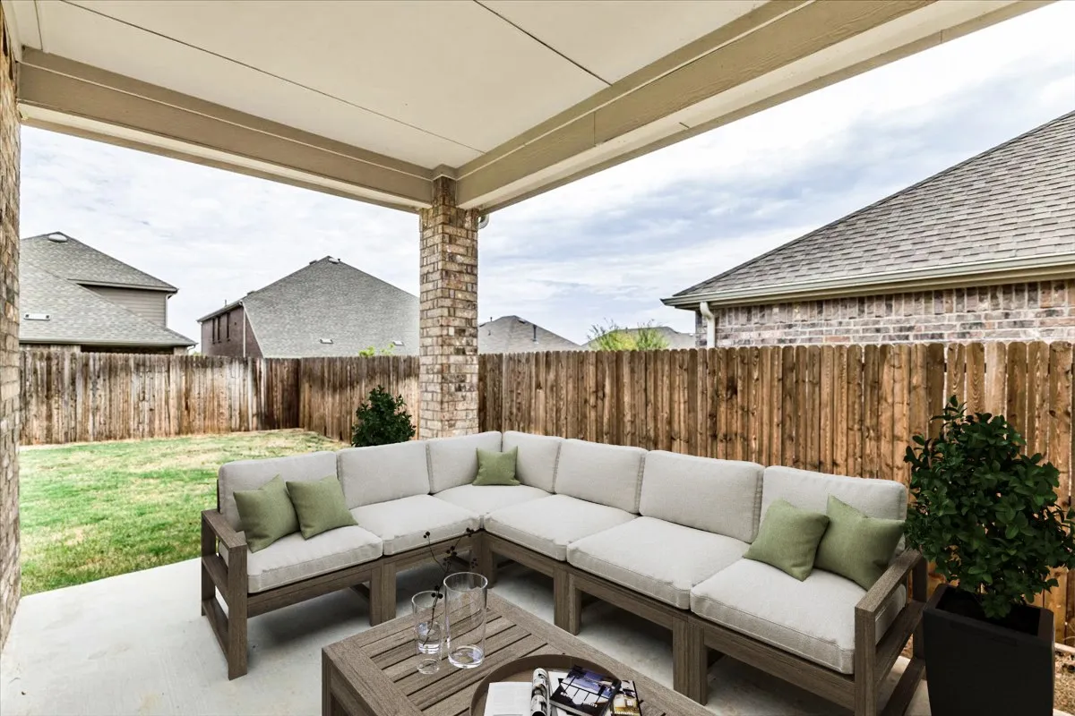 Rear covered patio virtually staged to show potential