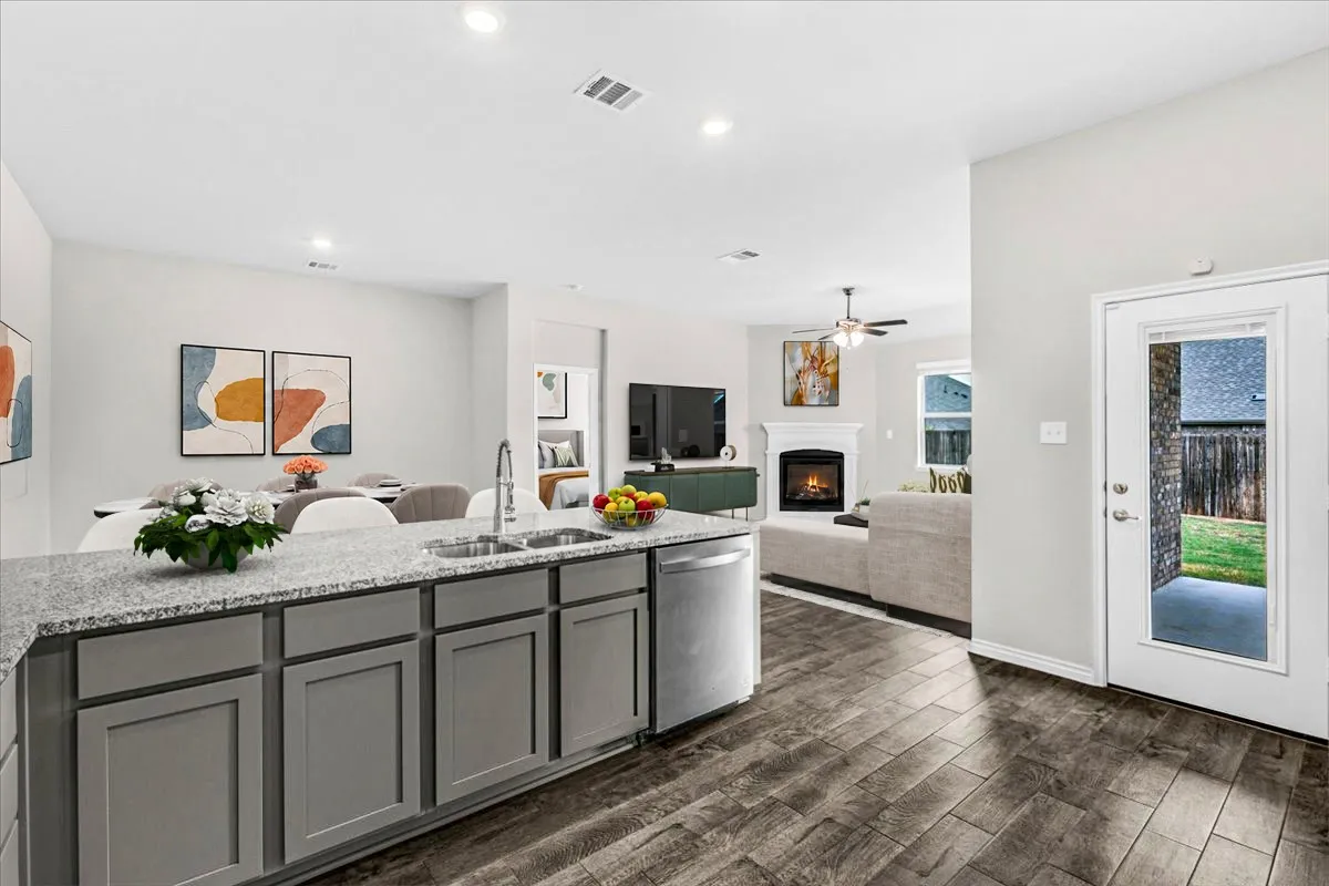 View from Kitchen Looking into Family Room Virtually staged to show potential