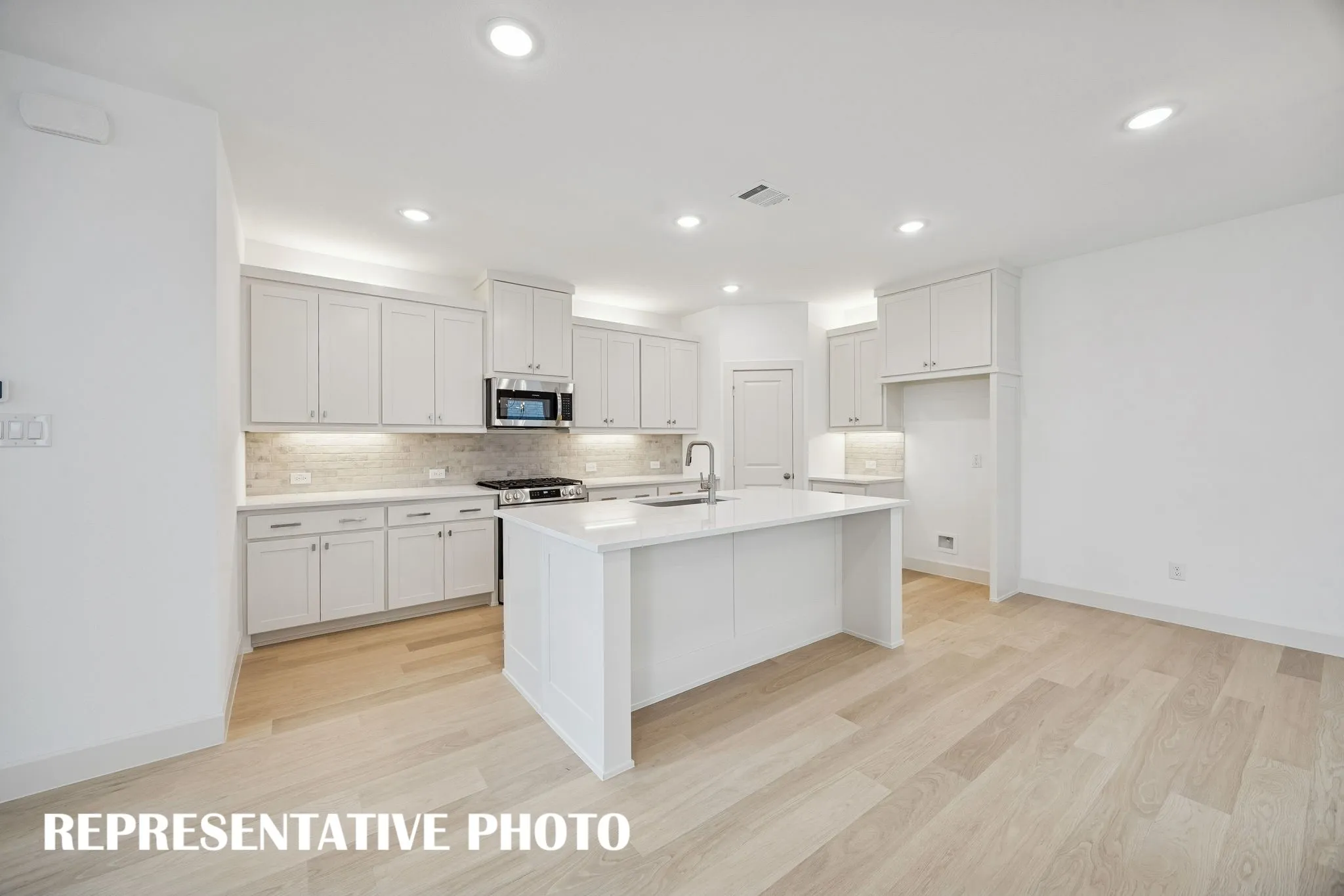 Featuring ample storage and prep space combined with beautiful finishes, this dream kitchen is all that you have been searching for!  REPRESENTATIVE PHOTO