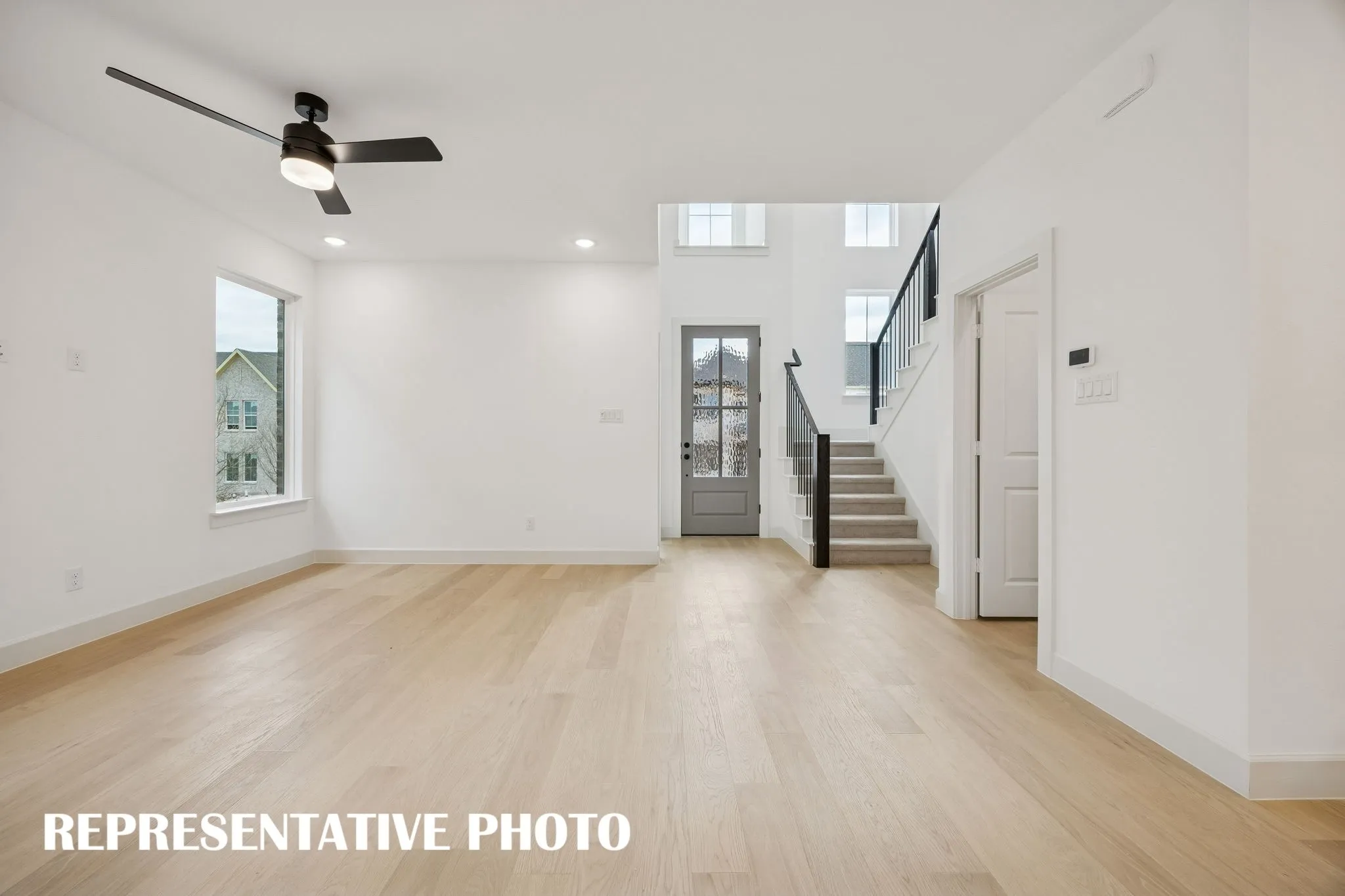You'll enjoy a spacious living room perfect for entertaining family and friends in our new Emmeline floor plan!  REPRESENTATIVE PHOTO