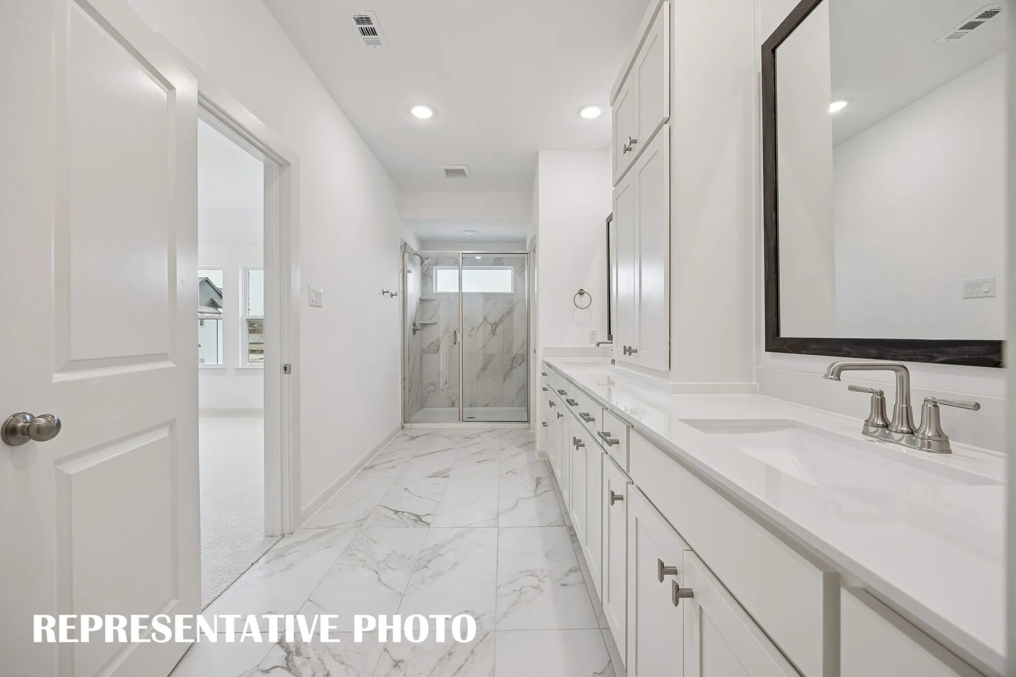 The spacious walk in shower is the cherry on top in this luxuriously finished owner's bath!  REPRESENTATIVE PHOTO