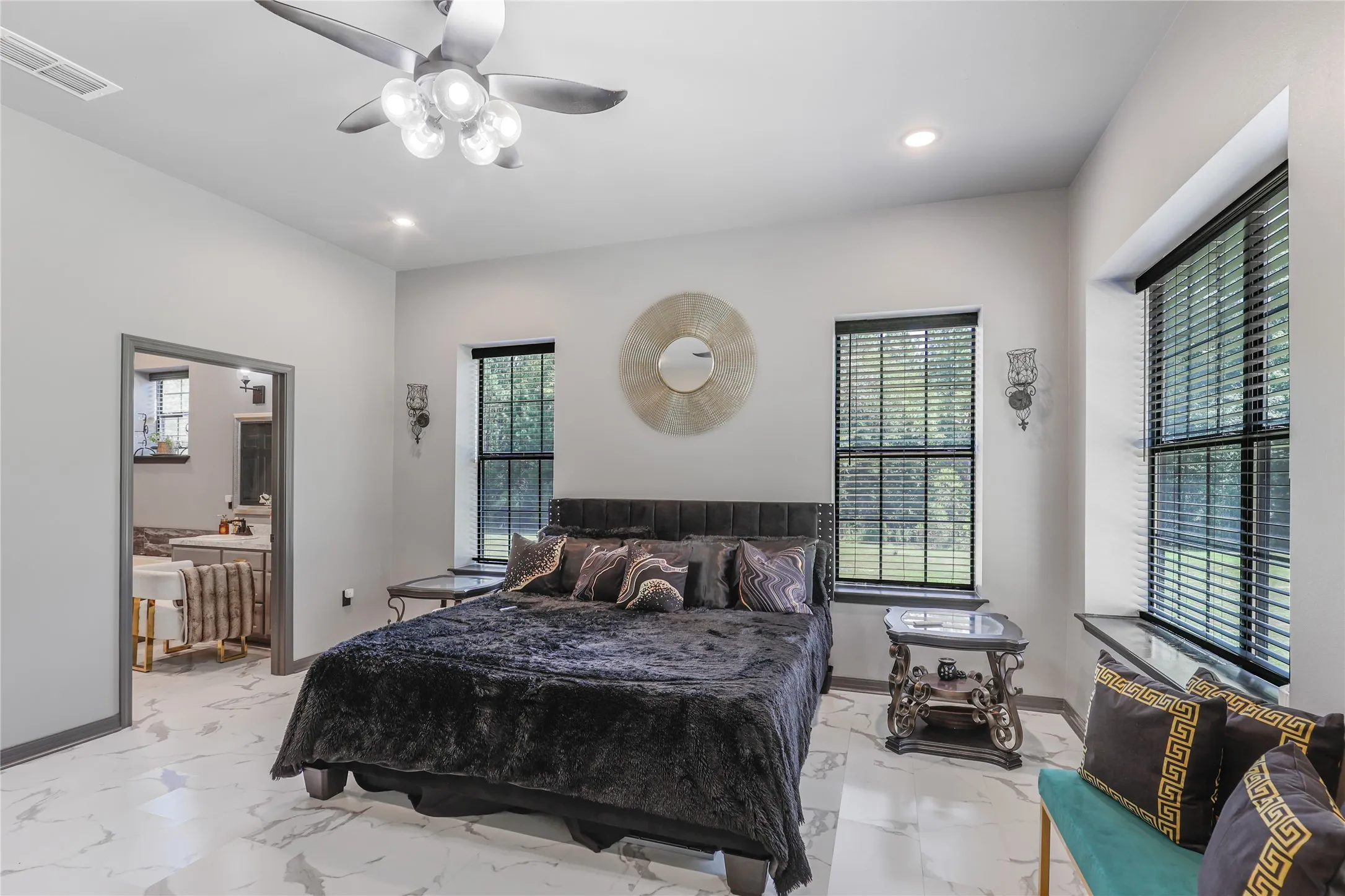 Recessed lighting, ceiling fan with integrated light fixture, multiple windows with blinds, and white tile flooring