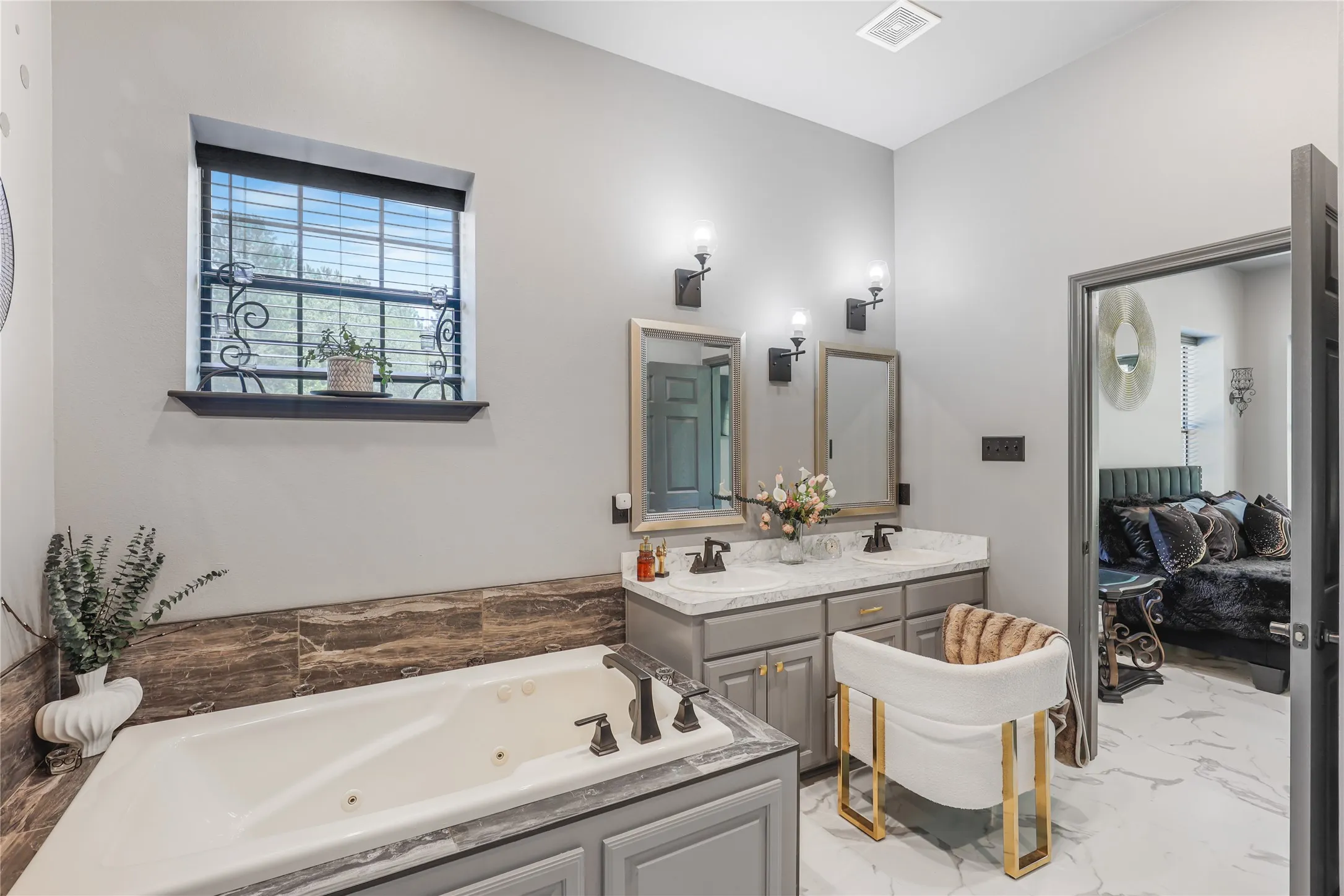 Dual vanity with undermount sinks and wall-mounted sconces