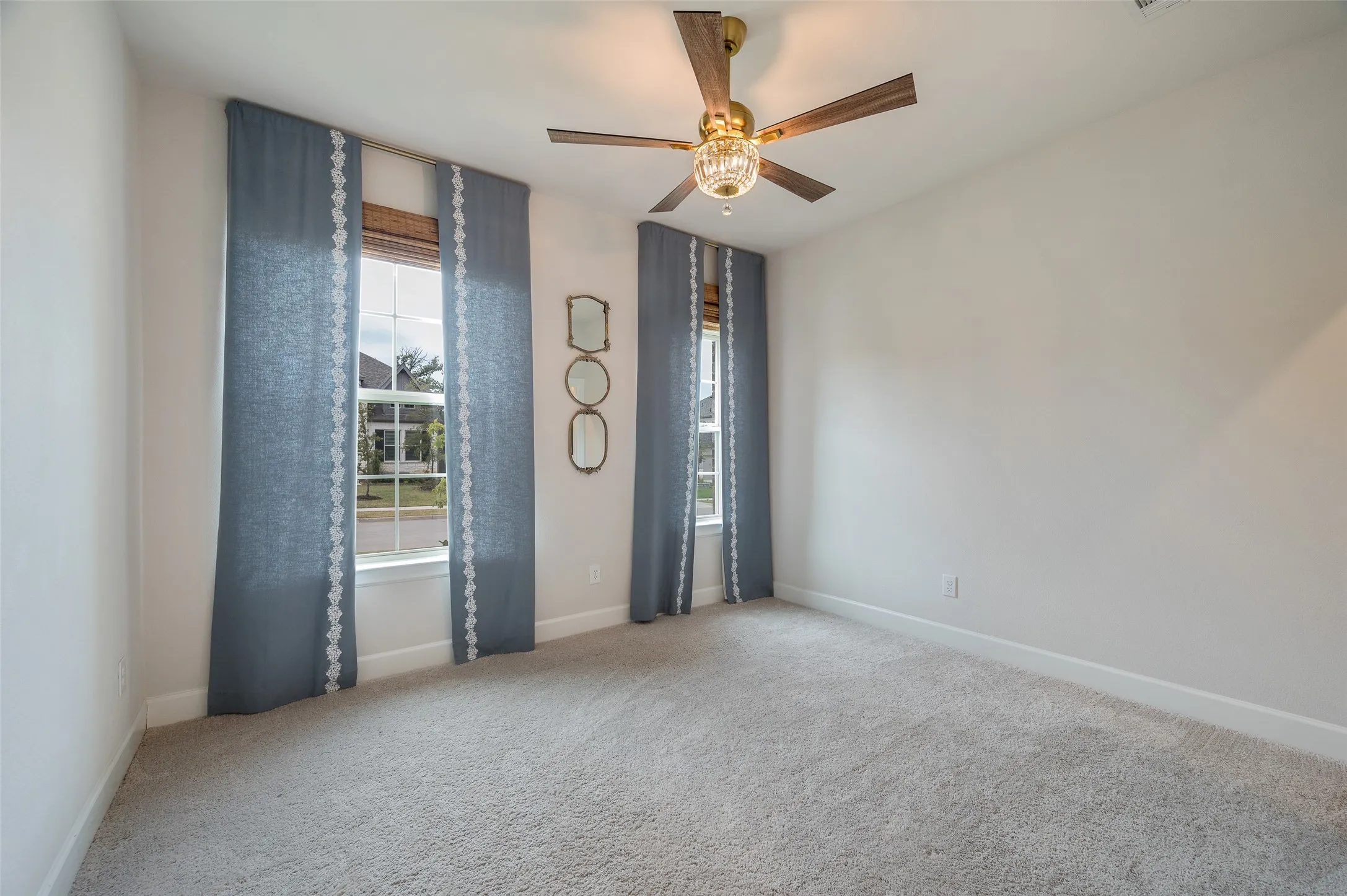 downstairs bedroom with upgraded fan