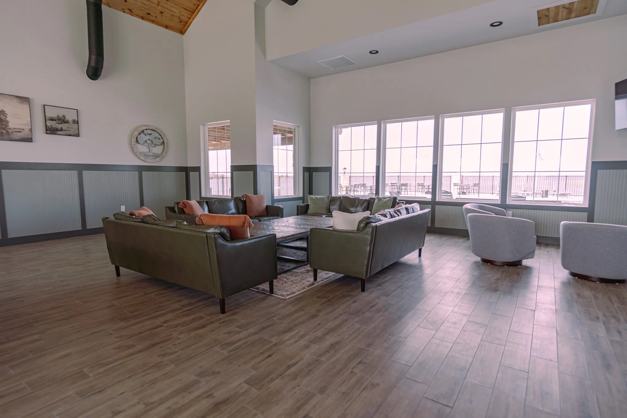 Living room featuring high vaulted ceiling