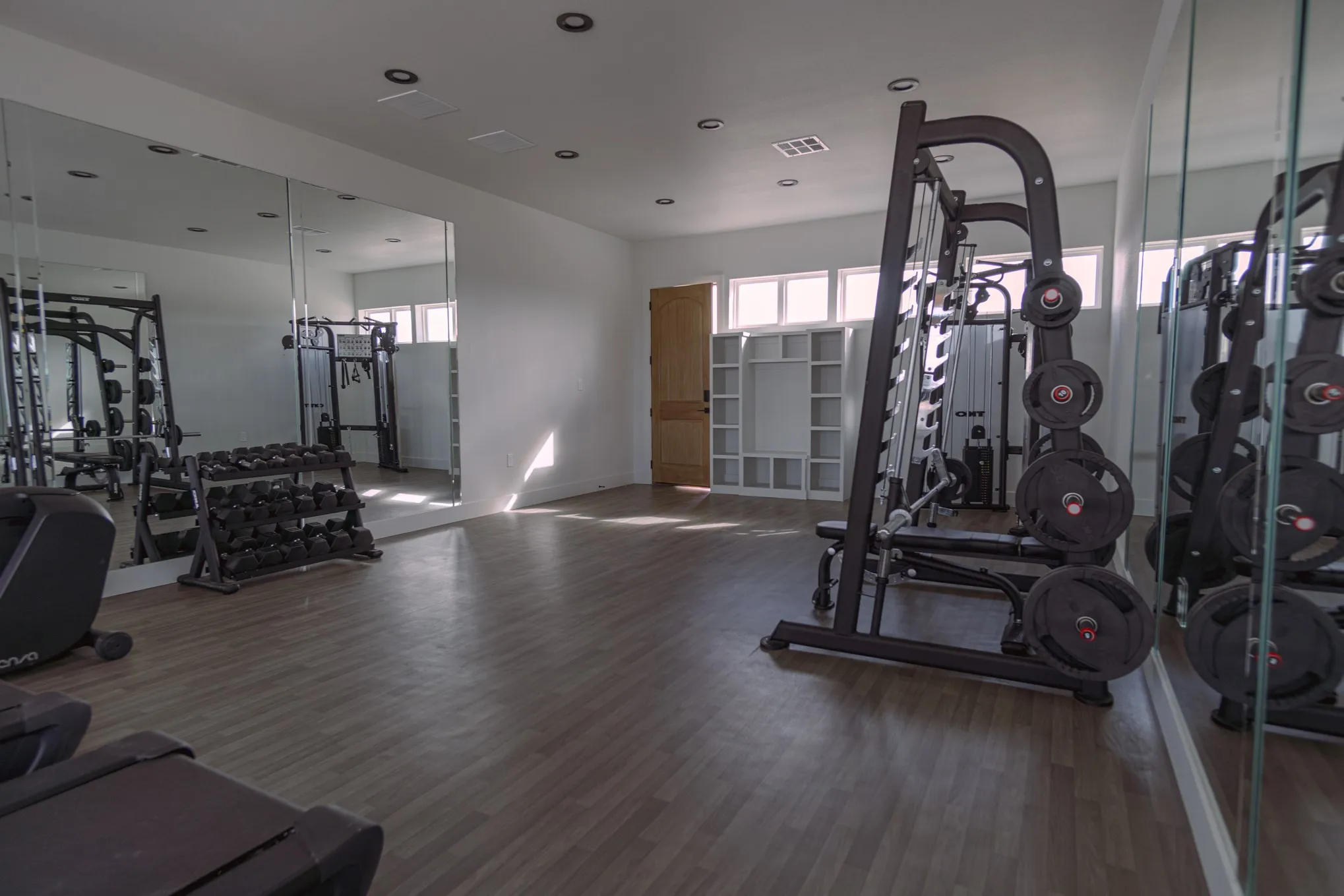 Gym with hardwood / wood-style floors