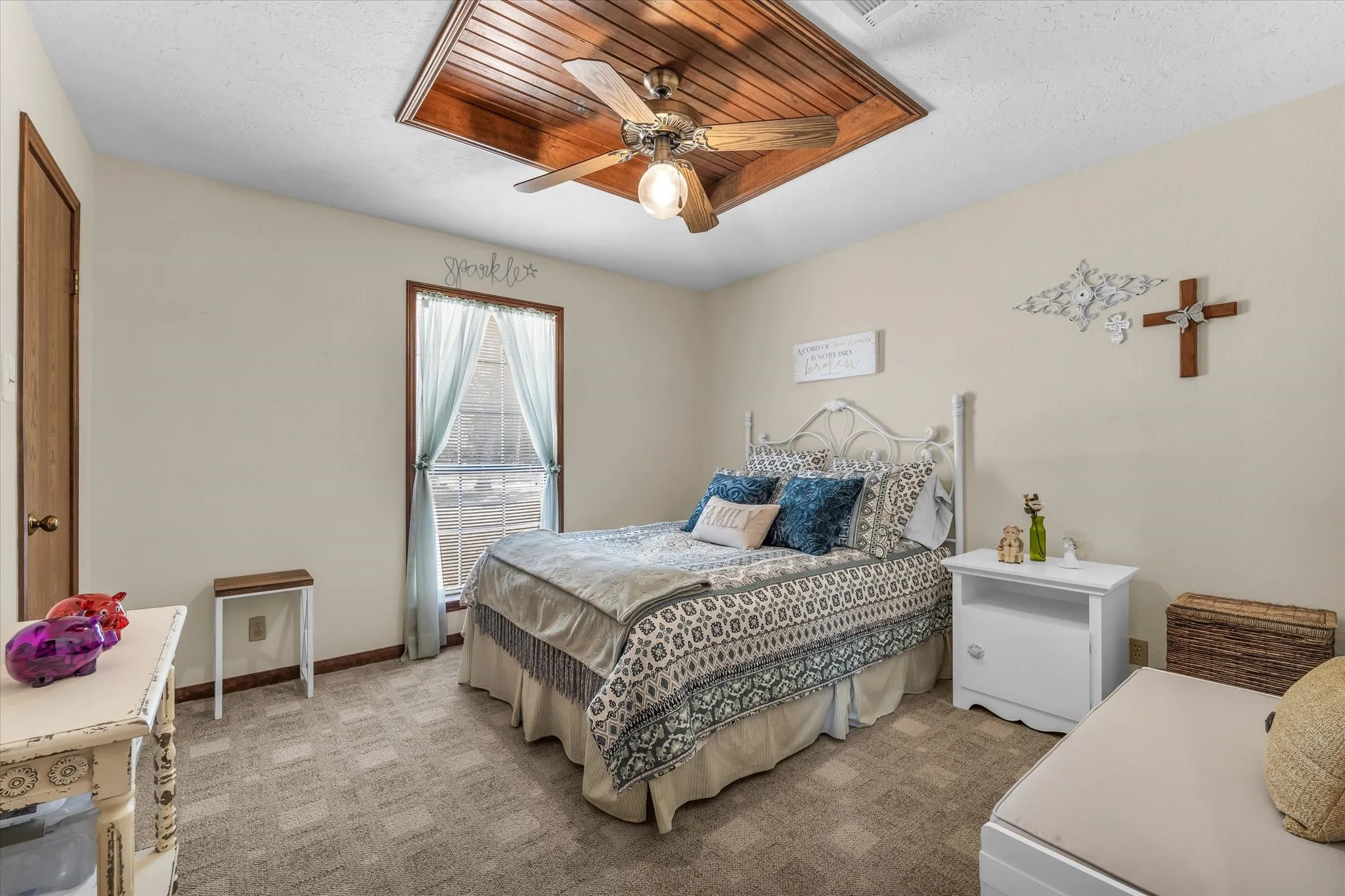 Wood-paneled ceiling accent with a ceiling fan