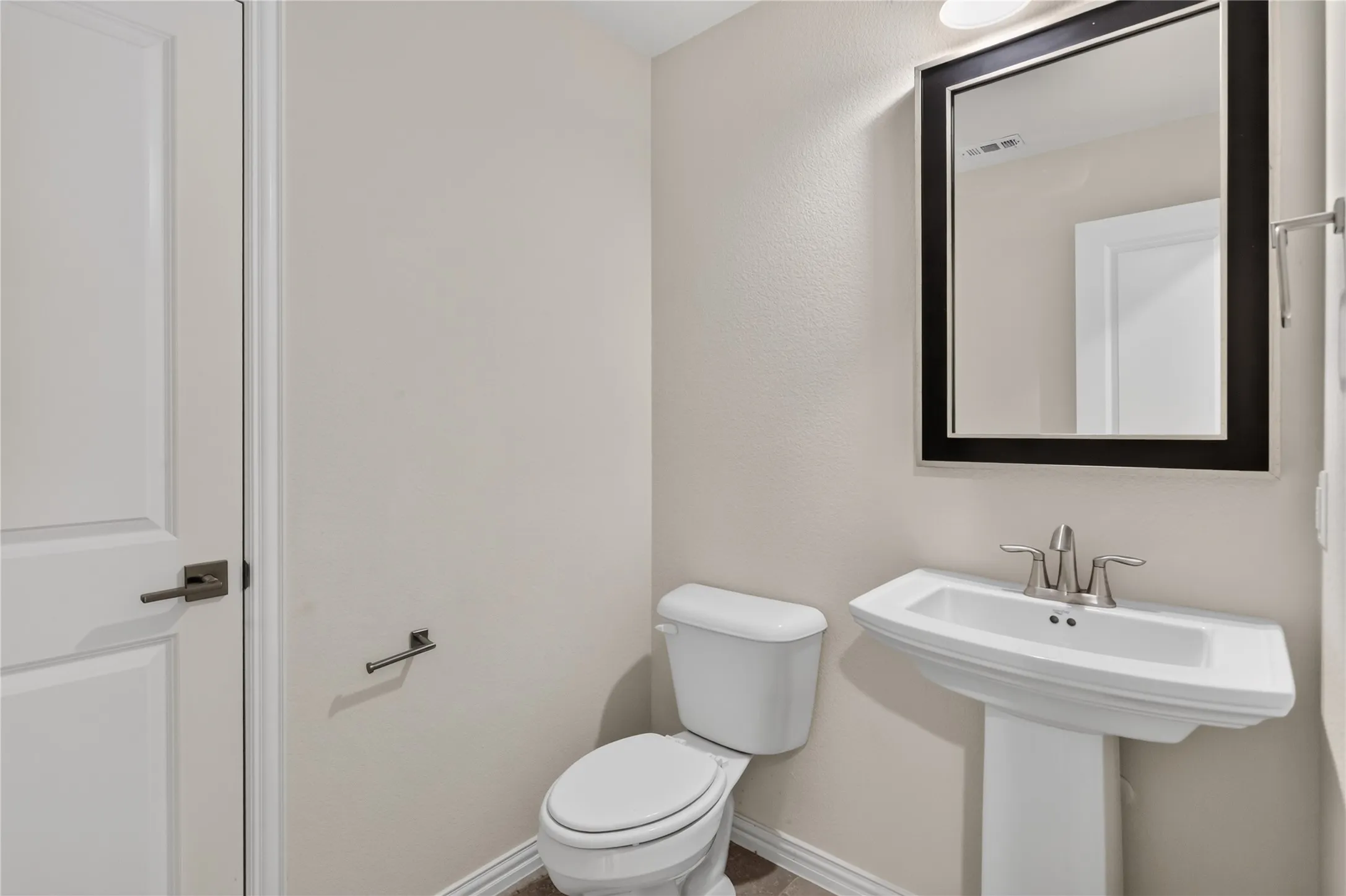 Upstairs half bathroom.
