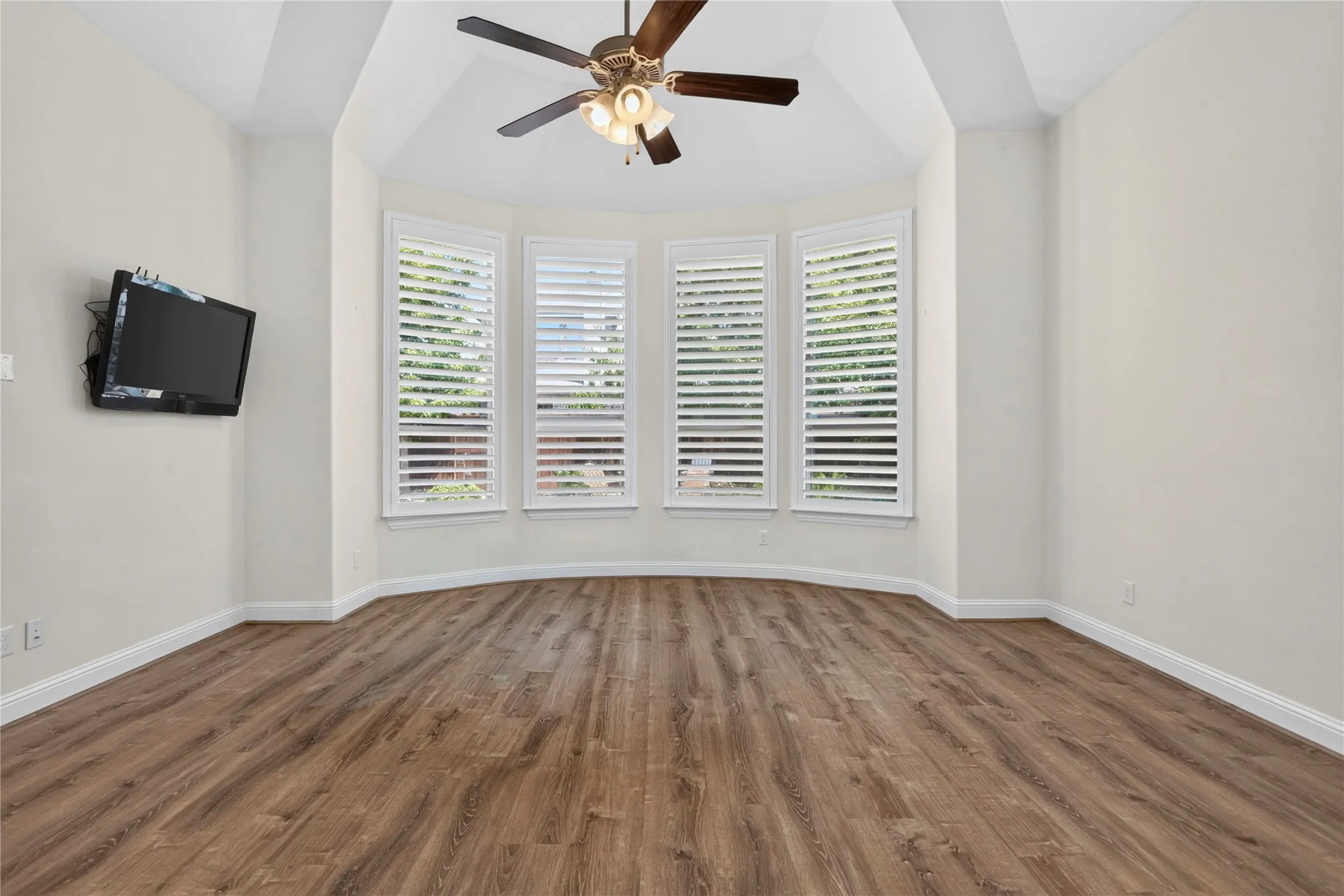 Primary bedroom, view from bathroom entry door.