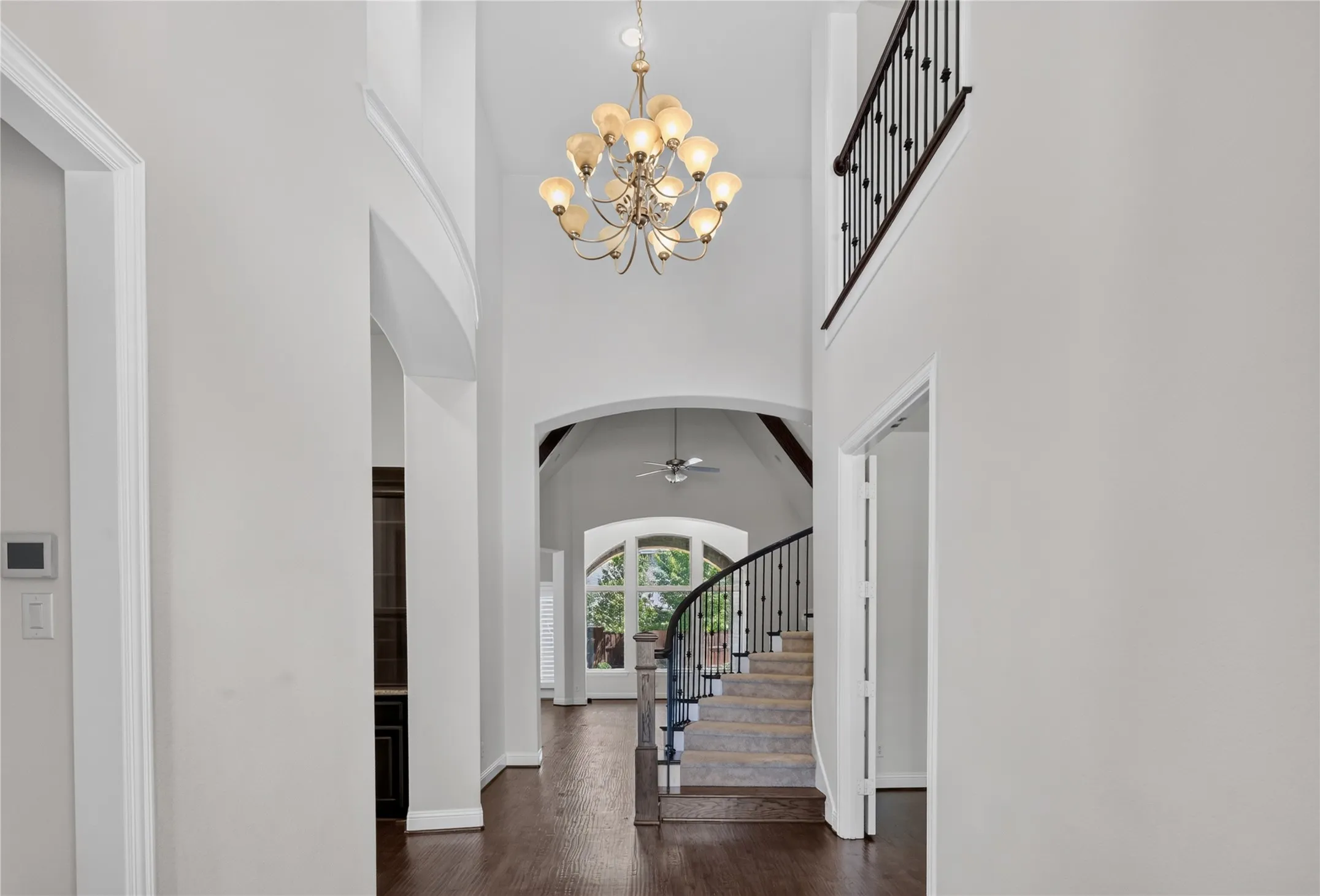 Two story open foyer with chandelier.