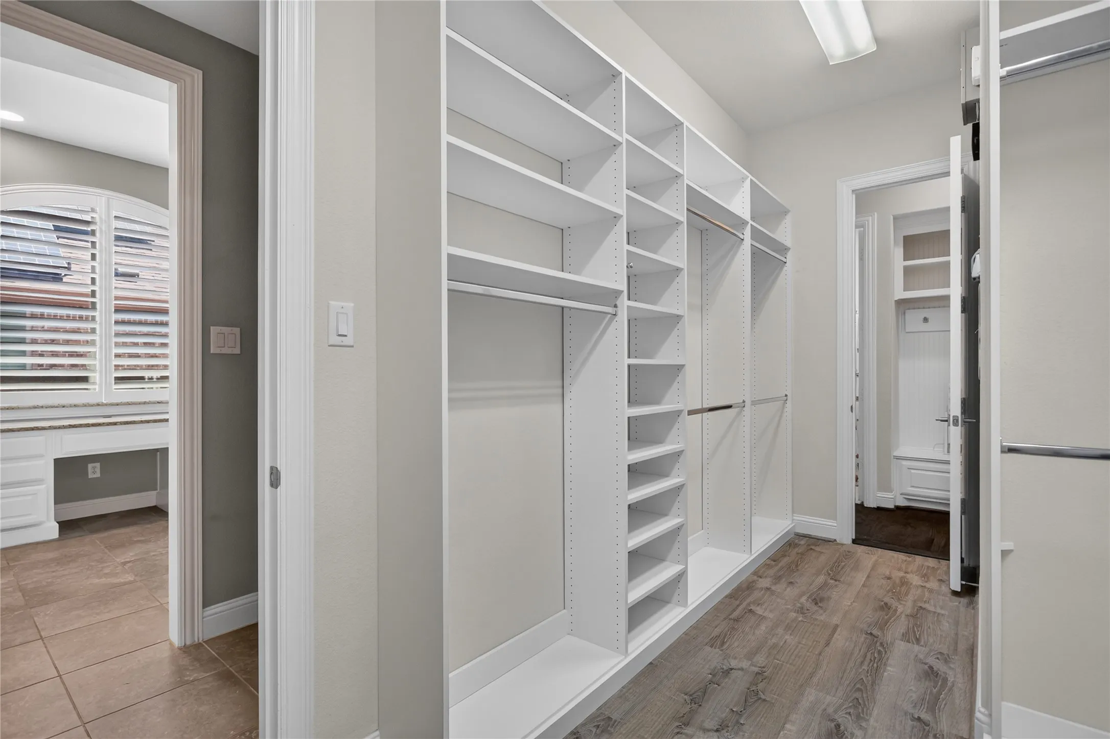 Primary closet, view from the bathroom.